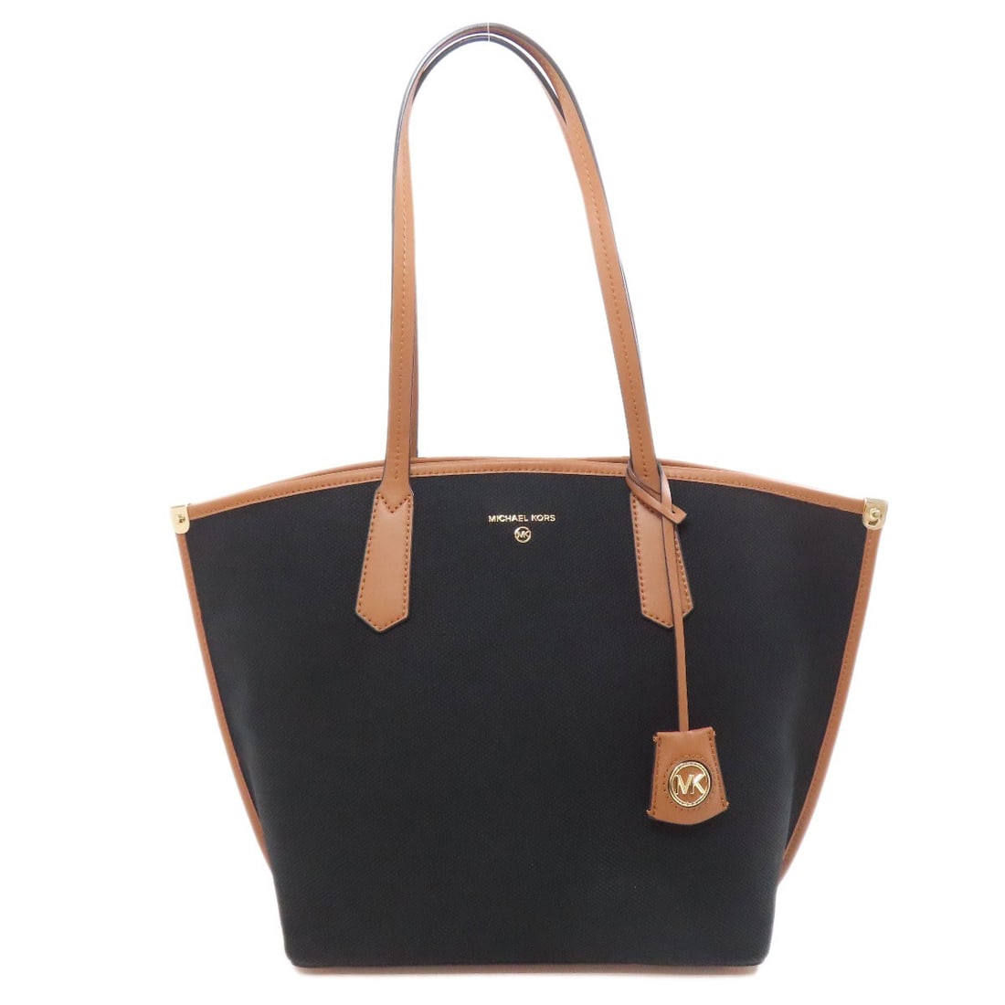 Michael Kors Canvas Jane Tote Bag: Michael Kors Canvas Jane Tote Bag Elevate your everyday style with the sleek and sophisticated Michael Kors Canvas Jane Tote Bag, boasting a chic black and brown canvas exterior that adds a touch of