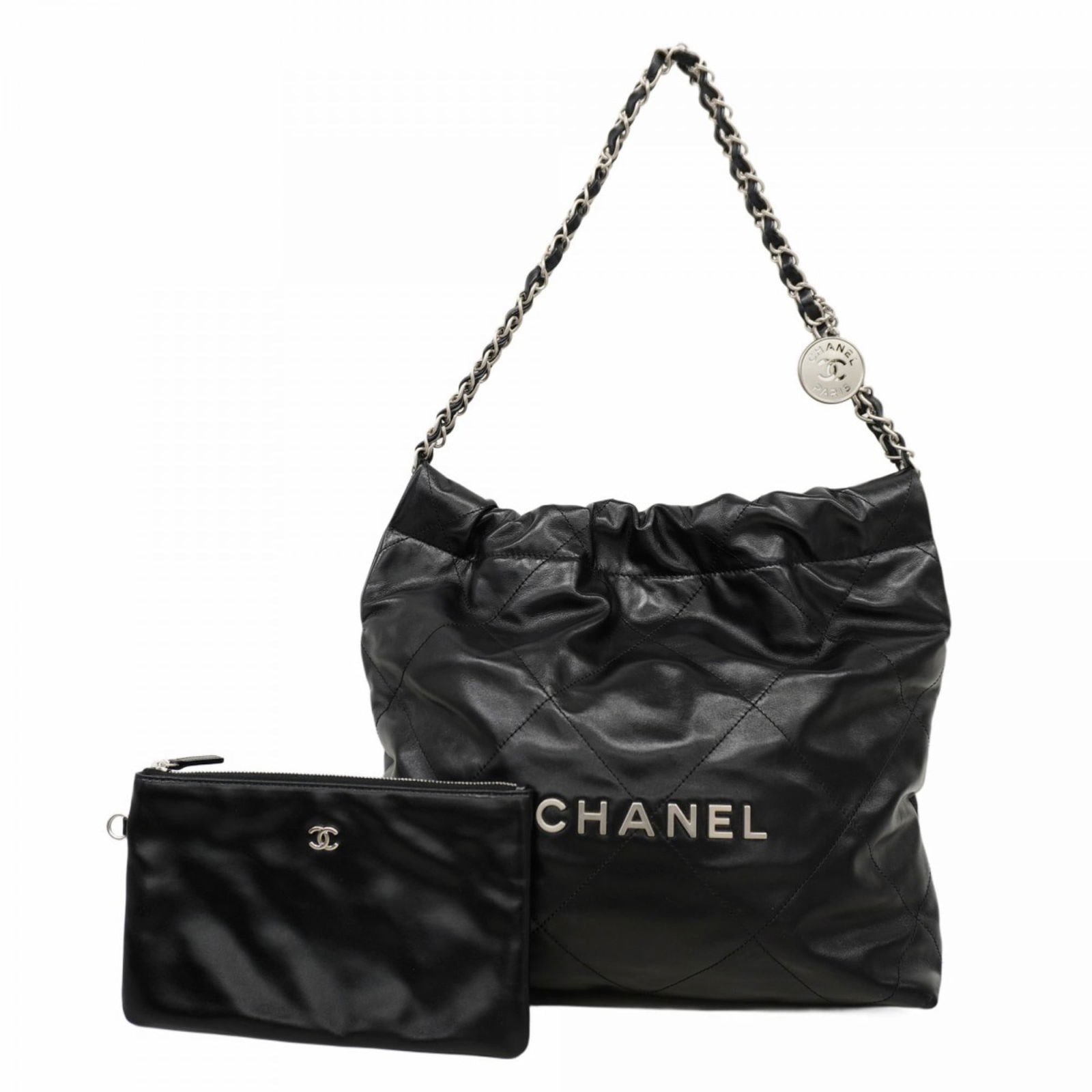 Chanel Shoulder Bag in Leather: Chanel Shoulder Bag in Leather A timeless Chanel shoulder bag in sleek black leather, adorned with elegant silver hardware, is up for grabs. With its classic design and premium materials, this piece