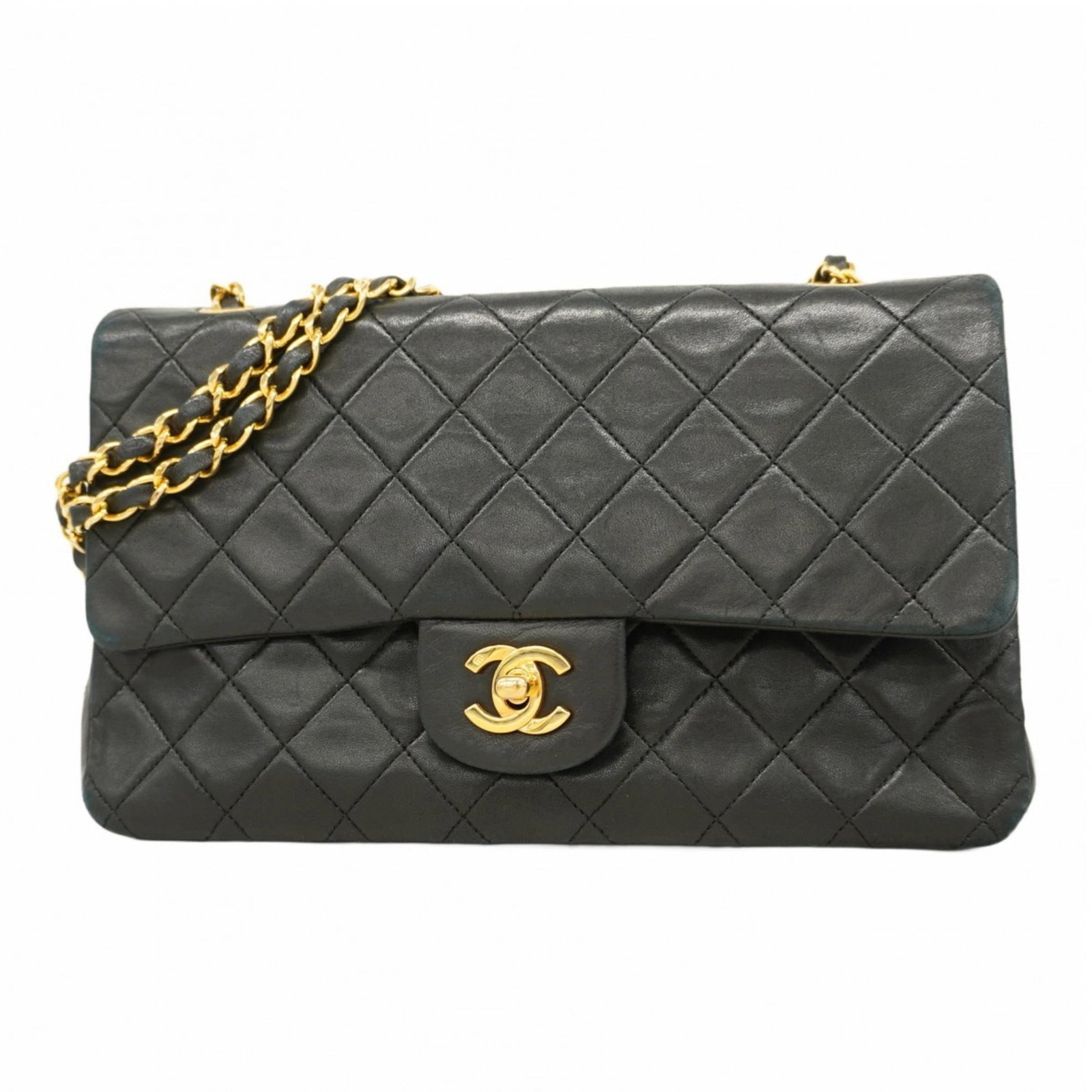 Chanel Shoulder Bag in Leather: Chanel Shoulder Bag in Leather A timeless Chanel shoulder bag in luxurious lambskin leather, this classic design exudes sophistication and elegance with its sleek black finish and gold hardware