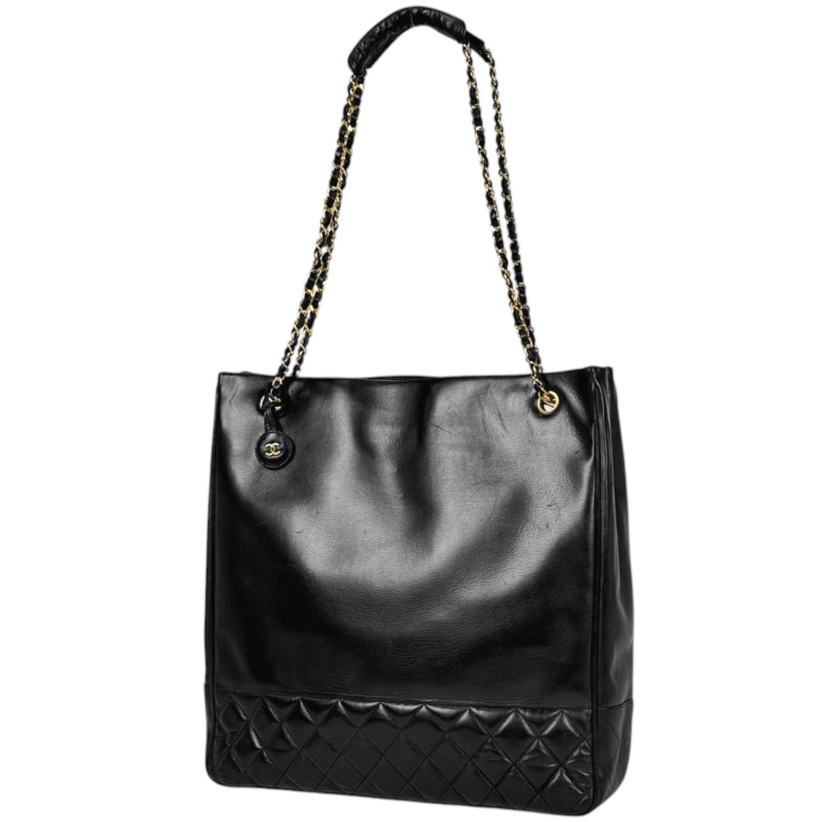 Chanel Tote Bag in Leather: Chanel Tote Bag in Leather A timeless and sophisticated Chanel tote bag in luxurious black leather, perfect for adding an air of elegance to any outfit. With its classic design and sturdy construction