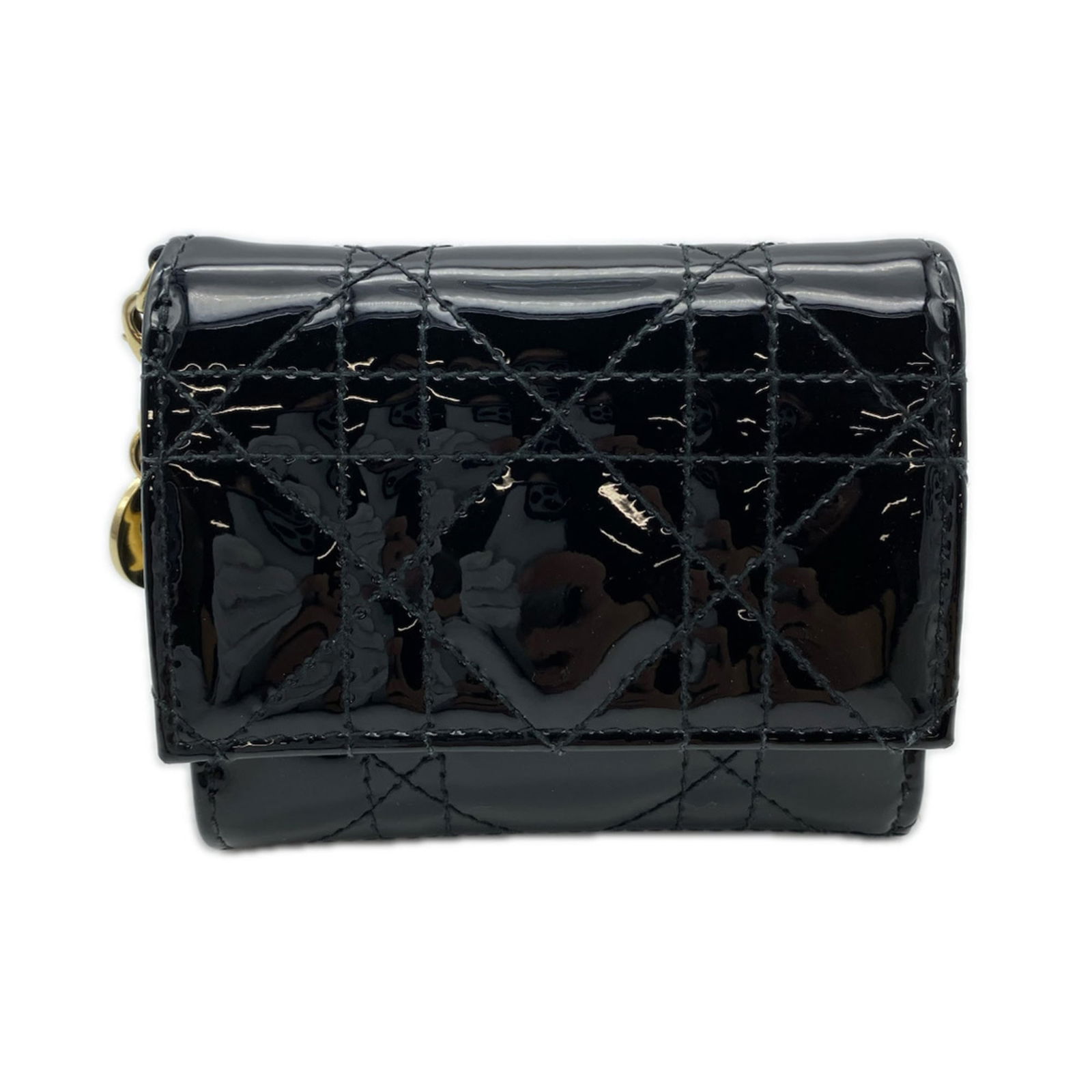 Patent Leather Tri-Fold Christian Dior Wallet: Patent Leather Tri-Fold Christian Dior Wallet A sleek and sophisticated tri-fold wallet from Christian Dior, crafted in premium patent leather that exudes luxury and elegance. With its classic design