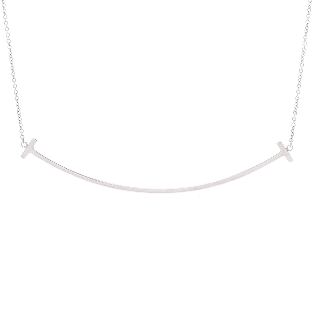 Tiffany & Co. T Smile Pendant Necklace in 18k White Gold: Tiffany & Co. T Smile Pendant Necklace in 18k White Gold A stunning Tiffany & Co. T Smile Pendant Necklace in 18k white gold, boasting exceptional craftsmanship and timeless elegance. With its