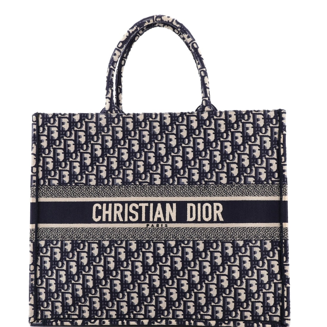Christian Dior Oblique Canvas Large Book Tote: Christian Dior Oblique Canvas Large Book Tote The Christian Dior Oblique Canvas Large Book Tote is a stunning, blue canvas tote that exudes luxury and sophistication. With its classic design and