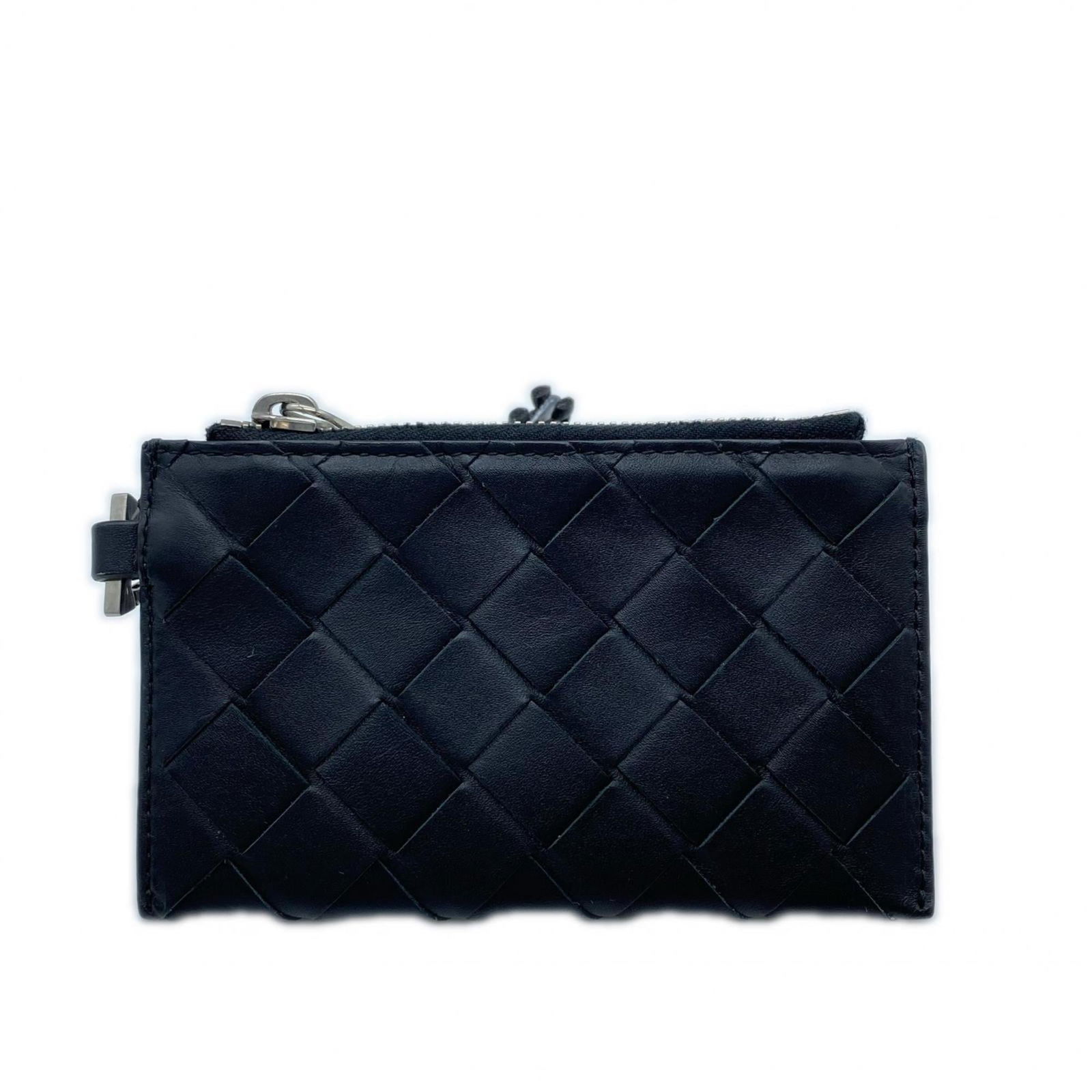 Bottega Veneta Coin Purse/ Case Leather: Bottega Veneta Coin Purse/ Case Leather A sleek and sophisticated Bottega Veneta coin purse, crafted from rich black leather, adds a touch of luxury to any outfit. With its classic design and subtle s