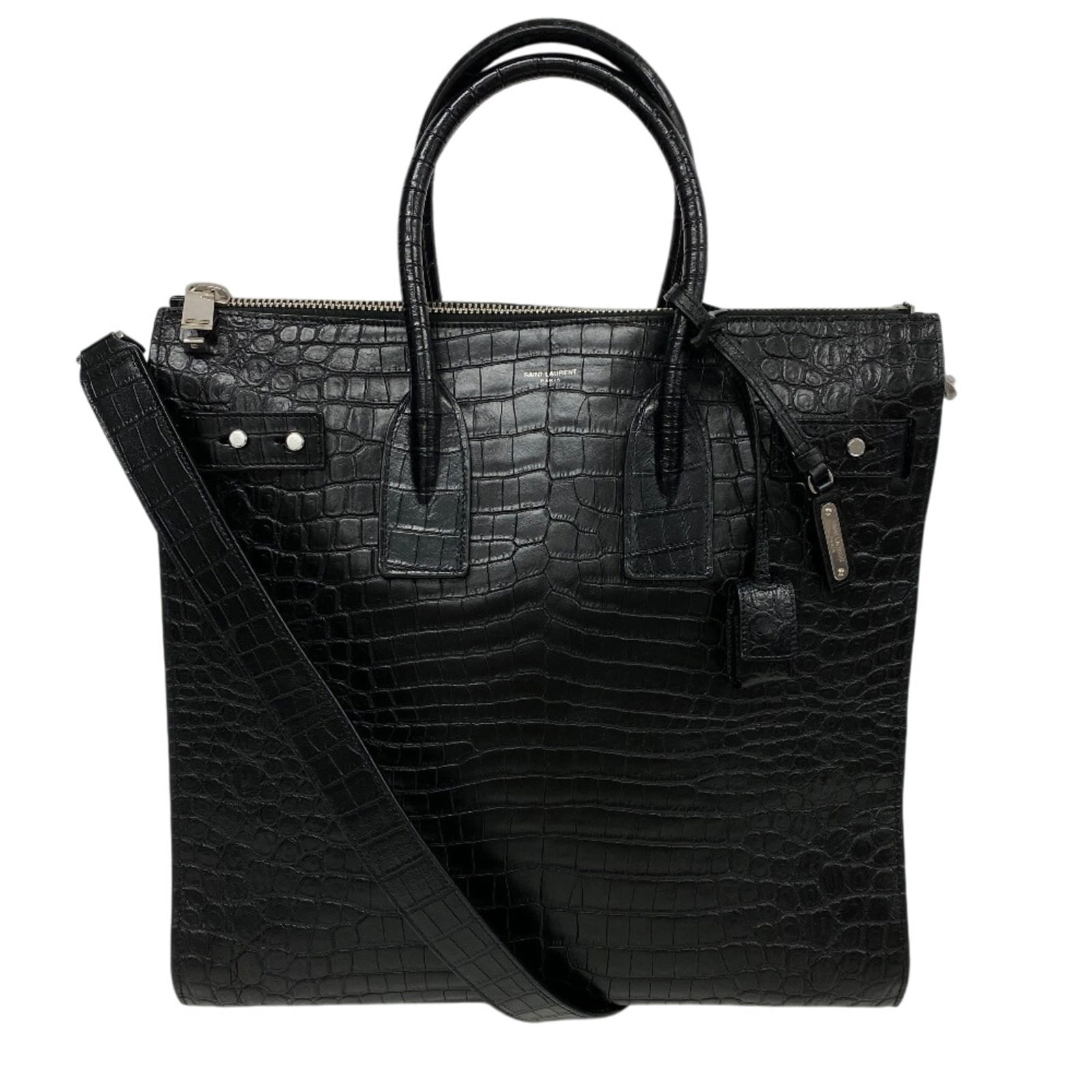 Yves Saint Laurent Leather Shoulder Bag: Yves Saint Laurent Leather Shoulder Bag Experience the timeless elegance of Yves Saint Laurent with this classic black leather shoulder bag, boasting embossed details and a sophisticated design that