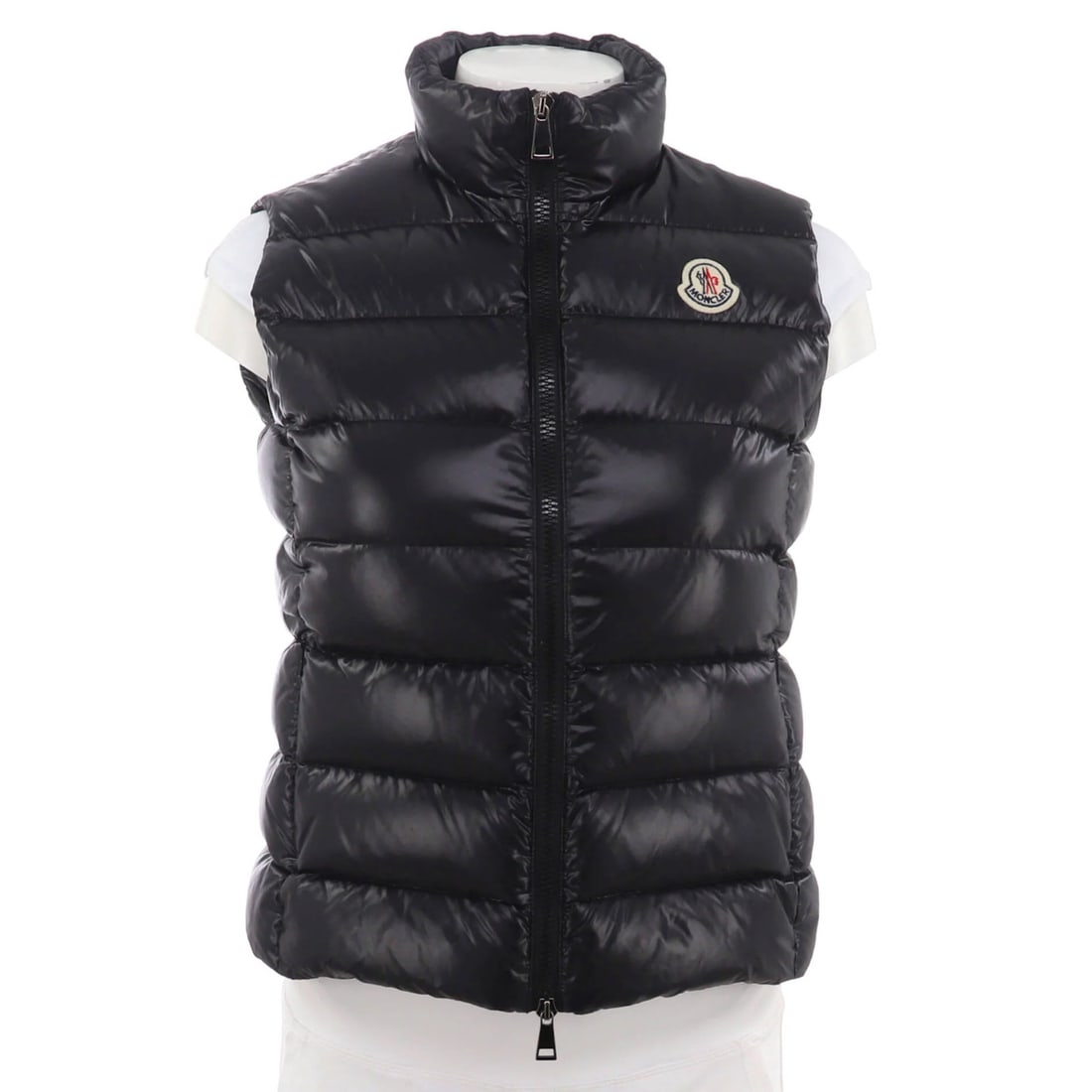 Down Moncler Women's Ghany Puffer Vest Quilted Polyamide with: Down Moncler Women's Ghany Puffer Vest Quilted Polyamide with Elevate your winter wardrobe with the Moncler Women's Ghany Puffer Vest, a luxurious quilted vest filled with down insulation for