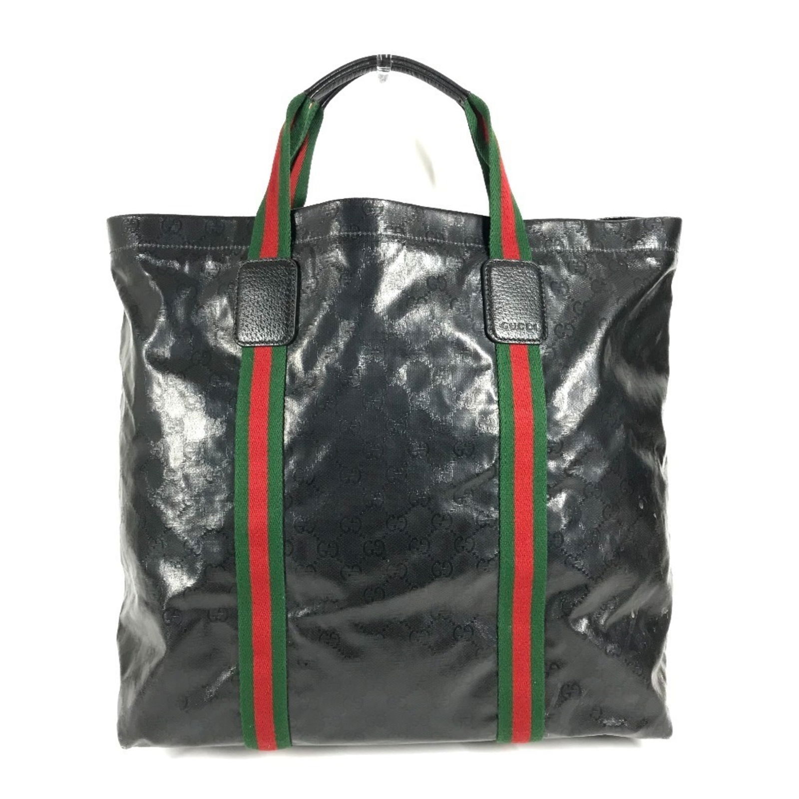 Gucci Tote Bag in Coated Canvas: Gucci Tote Bag in Coated Canvas A sleek and sophisticated Gucci tote bag in black coated canvas, perfect for adding a touch of luxury to your daily routine. With its classic design and durable