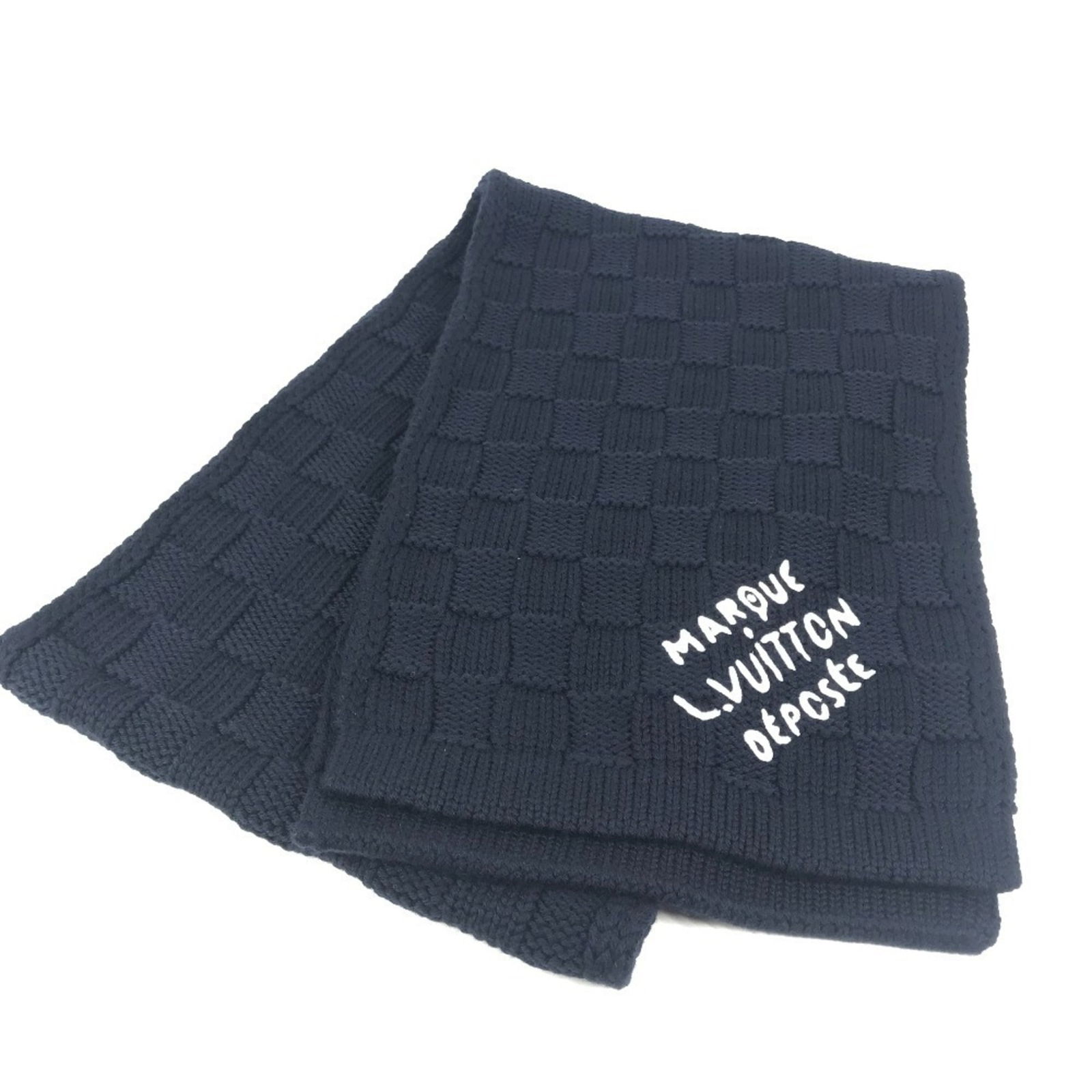 Wool Louis Vuitton Stole: Wool Louis Vuitton Stole A luxurious navy wool stole from the iconic Louis Vuitton brand, boasting classic monogram pattern and timeless design. With its generous 1.78m length and soft, woolen texture
