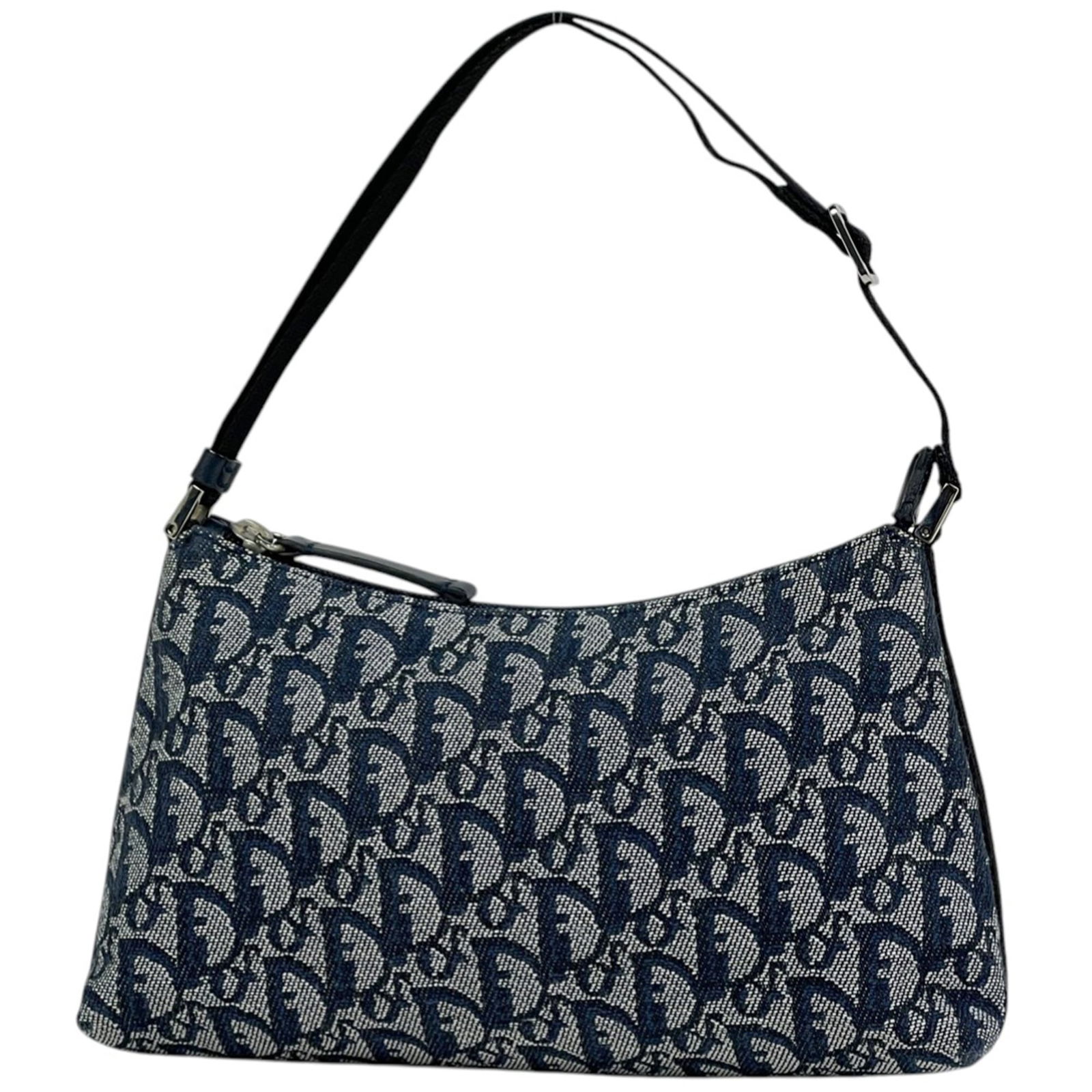 Christian Dior Canvas and Leather Shoulder Bag: Christian Dior Canvas and Leather Shoulder Bag A timeless Christian Dior shoulder bag, crafted from luxurious canvas and supple leather, boasts a classic navy hue that exudes sophistication. With its