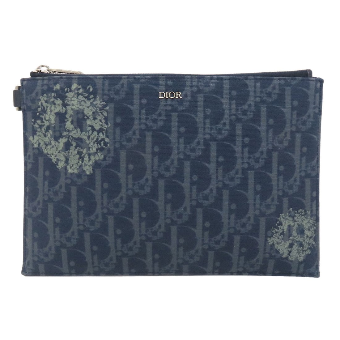 Christian Dior Tears Oblique Pouch in Canvas: Christian Dior Tears Oblique Pouch in Canvas The Christian Dior Tears Oblique Pouch in Canvas is a timeless accessory that exudes understated elegance, thanks to its classic oblique shape and navy