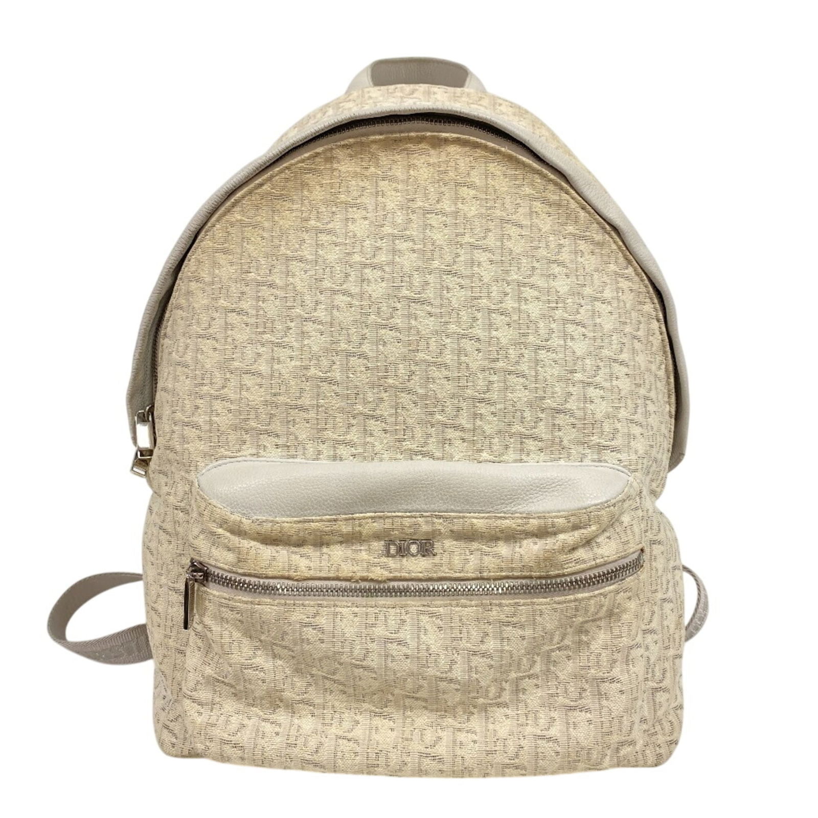 Christian Dior Canvas Backpack: Christian Dior Canvas Backpack A pristine white canvas backpack from Christian Dior, perfect for adding a touch of luxury to your daily commute or weekend adventures. With its classic design and