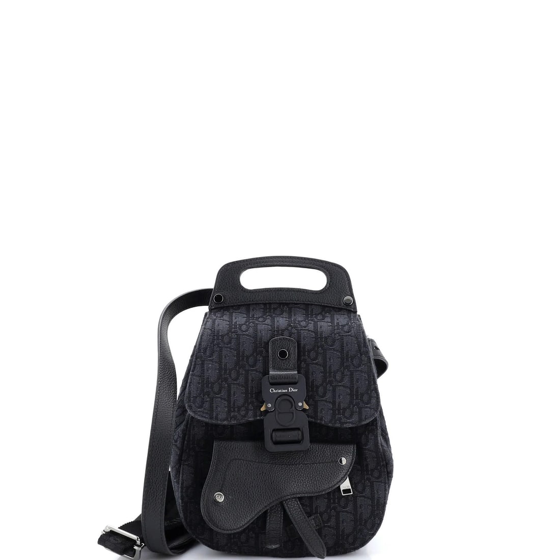 Christian Dior Mini Oblique Canvas Saddle Backpack: Christian Dior Mini Oblique Canvas Saddle Backpack Elevate your everyday style with the iconic Christian Dior Mini Oblique Canvas Saddle Backpack, boasting sleek black canvas exterior and spacious int