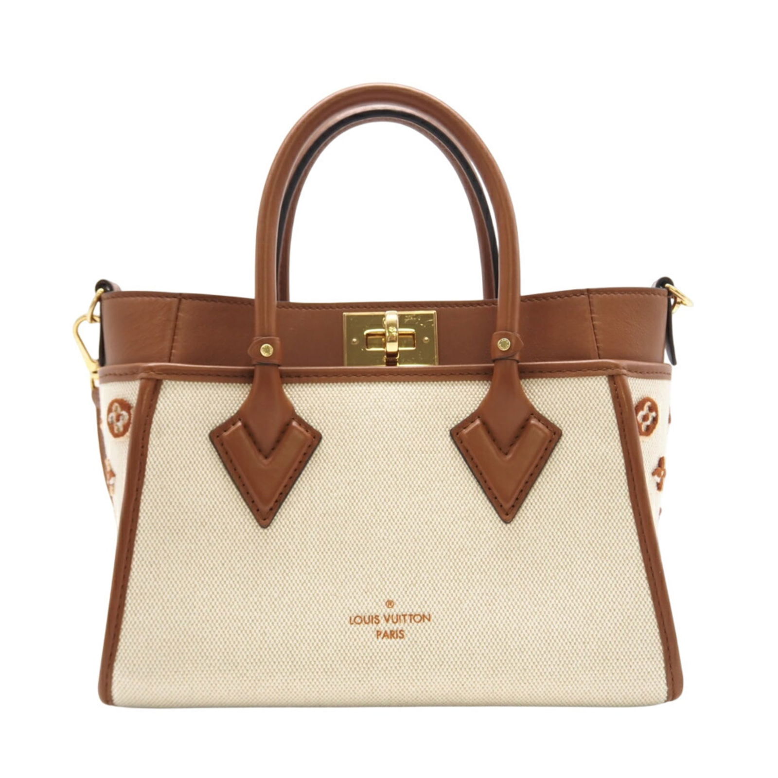 Louis Vuitton Canvas and Leather Shoulder Bag: Louis Vuitton Canvas and Leather Shoulder Bag A timeless and stylish shoulder bag from the iconic Louis Vuitton brand, this beige brown canvas and leather tote boasts a classic design with a modern