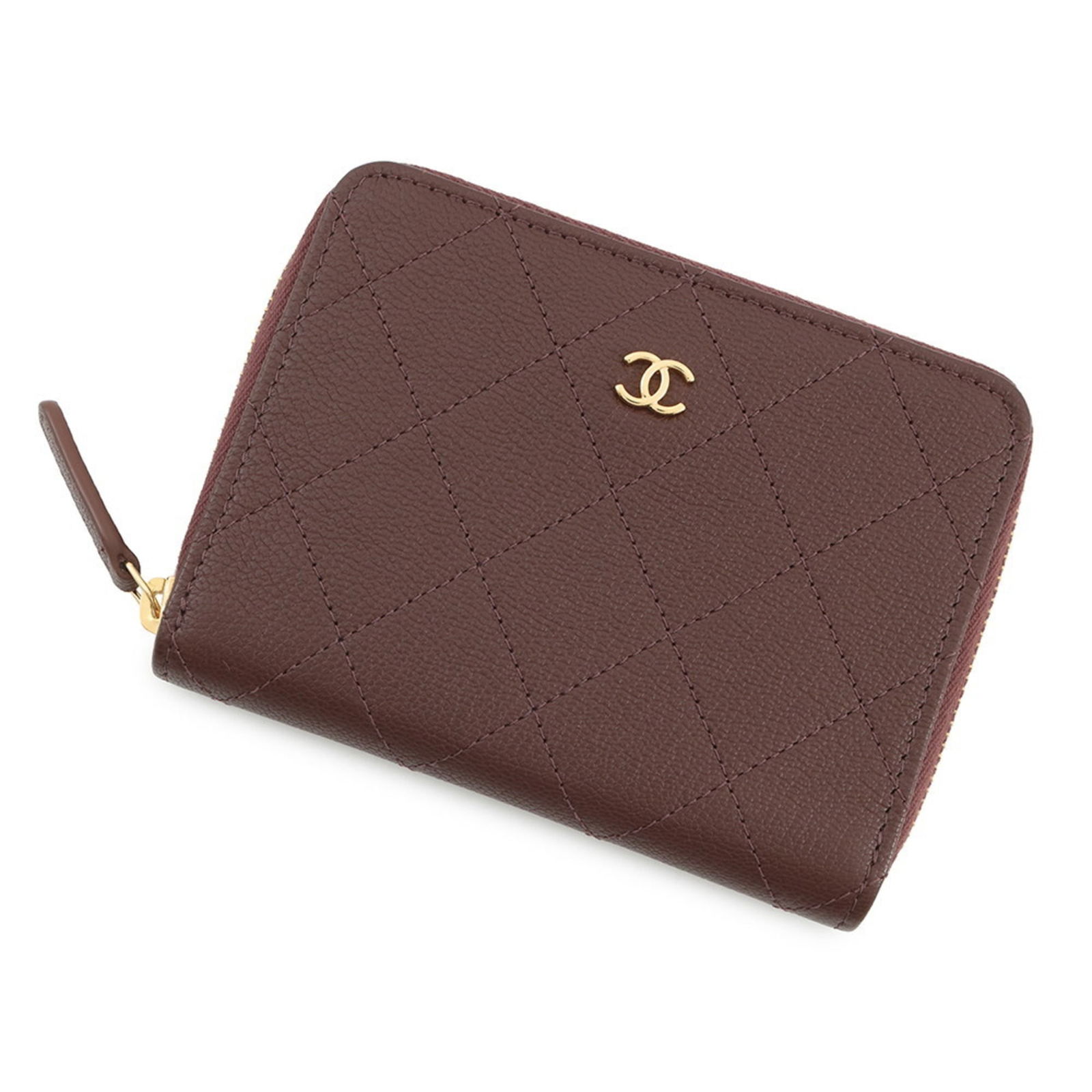 Chanel Bi-Fold Leather Wallet: Chanel Bi-Fold Leather Wallet A timeless piece of luxury, the Chanel bi-fold leather wallet exudes understated sophistication with its rich brown goatskin exterior and classic design. Its durable