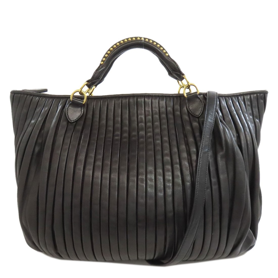 Calf MIUMIU 2WAY Handbag: Calf MIUMIU 2WAY Handbag The MIUMIU Calf 2WAY Handbag is a sleek and sophisticated accessory that combines style with versatility. Crafted from high-quality calf leather, this Italian design boasts a