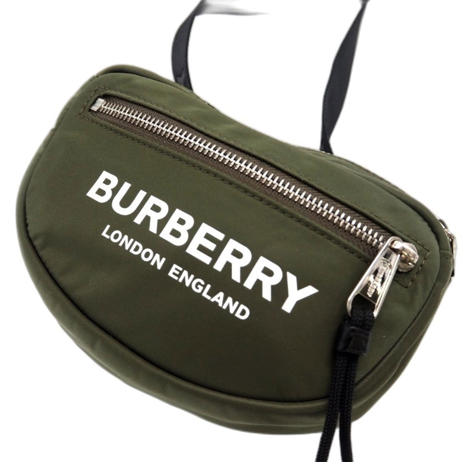 Burberry Fanny Pack in Nylon: Burberry Fanny Pack in Nylon A classic Burberry fanny pack, perfect for adding a touch of timeless style to your everyday look. With its durable nylon construction and zippered pockets, this