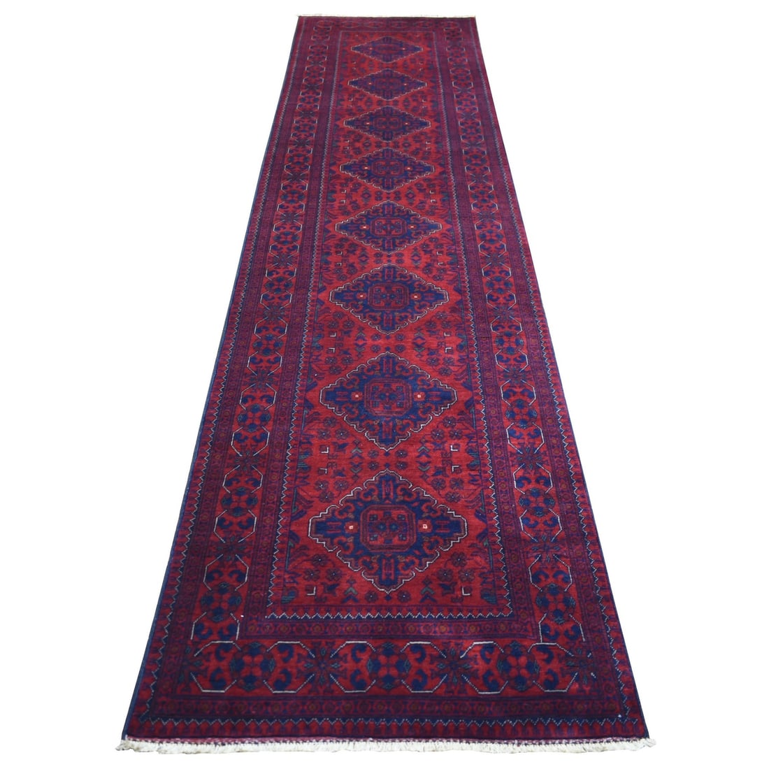 Deep Red Soft Wool Hand-Knotted Afghan Khamyab Runner Rug (2'10"x12'6"): Deep Red Soft Wool Hand-Knotted Afghan Khamyab Runner Rug (2'10"x12'6") Experience the rich warmth and beauty of traditional Afghan craftsmanship with this stunning Deep Red Soft Wool Hand-Knotted Afg