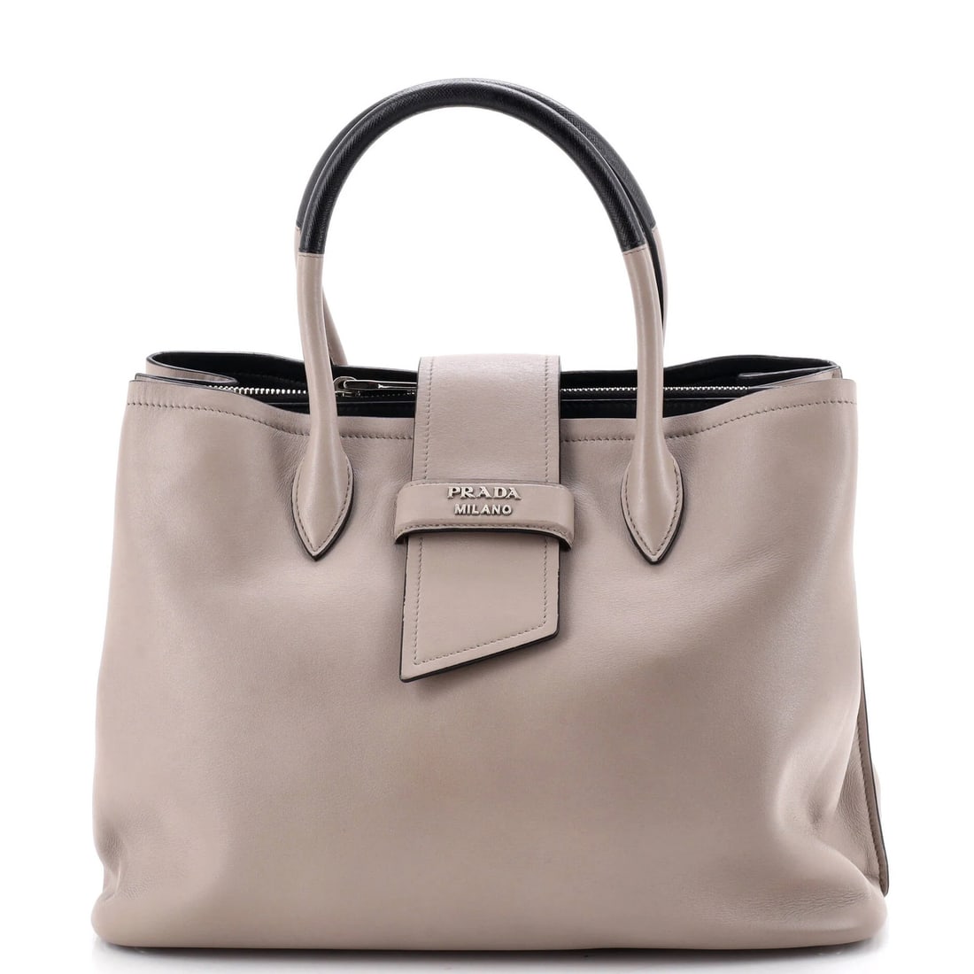 Prada Medium Calfskin City Tote: Prada Medium Calfskin City Tote A timeless and sophisticated Prada City Tote in neutral leather, boasting a classic medium size with a chic clochette and adjustable strap for effortless carrying. The