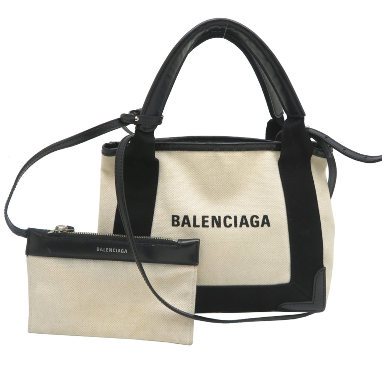 Leather - Balenciaga Handbag - Pouch Canvas: Leather - Balenciaga Handbag - Pouch Canvas A sleek and stylish Balenciaga pouch handbag, crafted from high-quality canvas and leather, boasts a chic black and white color scheme that adds an edgy
