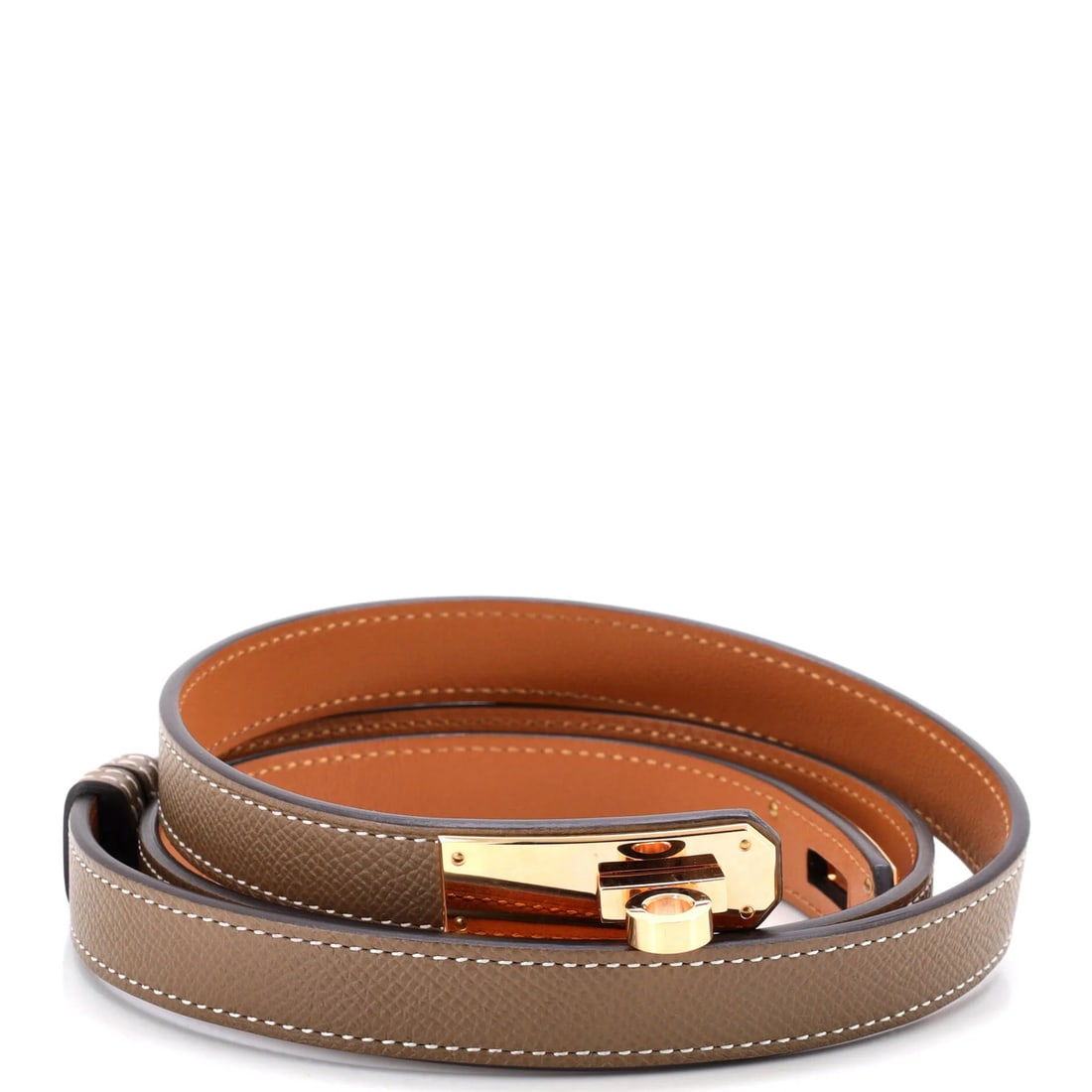 Hermes Kelly Belt in Thin Leather: Hermes Kelly Belt in Thin Leather A timeless piece from the iconic Herm?s Kelly collection, this thin leather belt boasts sleek neutral tones and elegant rose gold hardware. With its classic design
