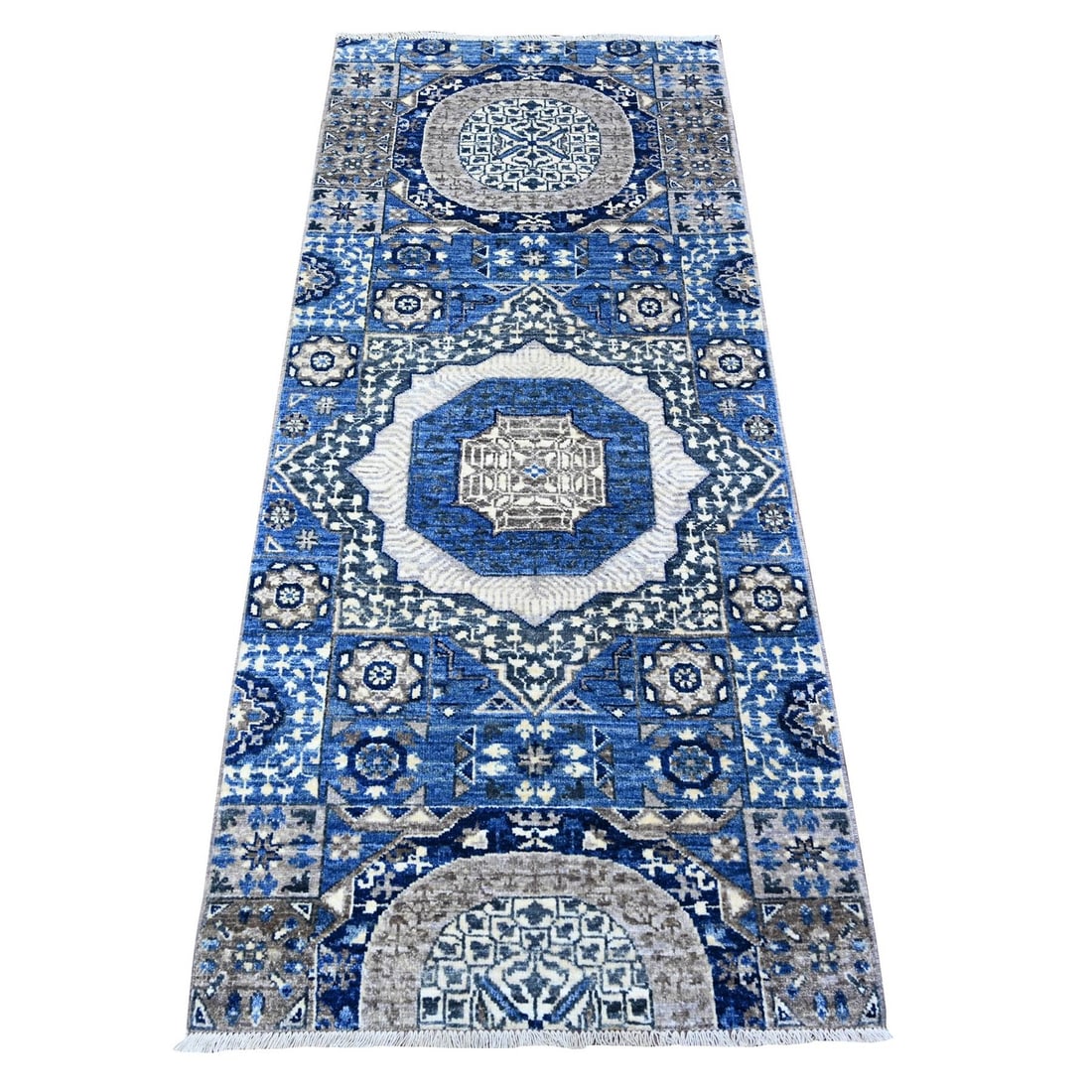 Aryana Blue Fine Wool Hand-Knotted Oriental Rug (2'6"x6'): Aryana Blue Fine Wool Hand-Knotted Oriental Rug (2'6"x6') Experience the timeless beauty of an Afghan-made, hand-knotted fine wool rug, expertly woven in a stunning blue hue reminiscent of a clear