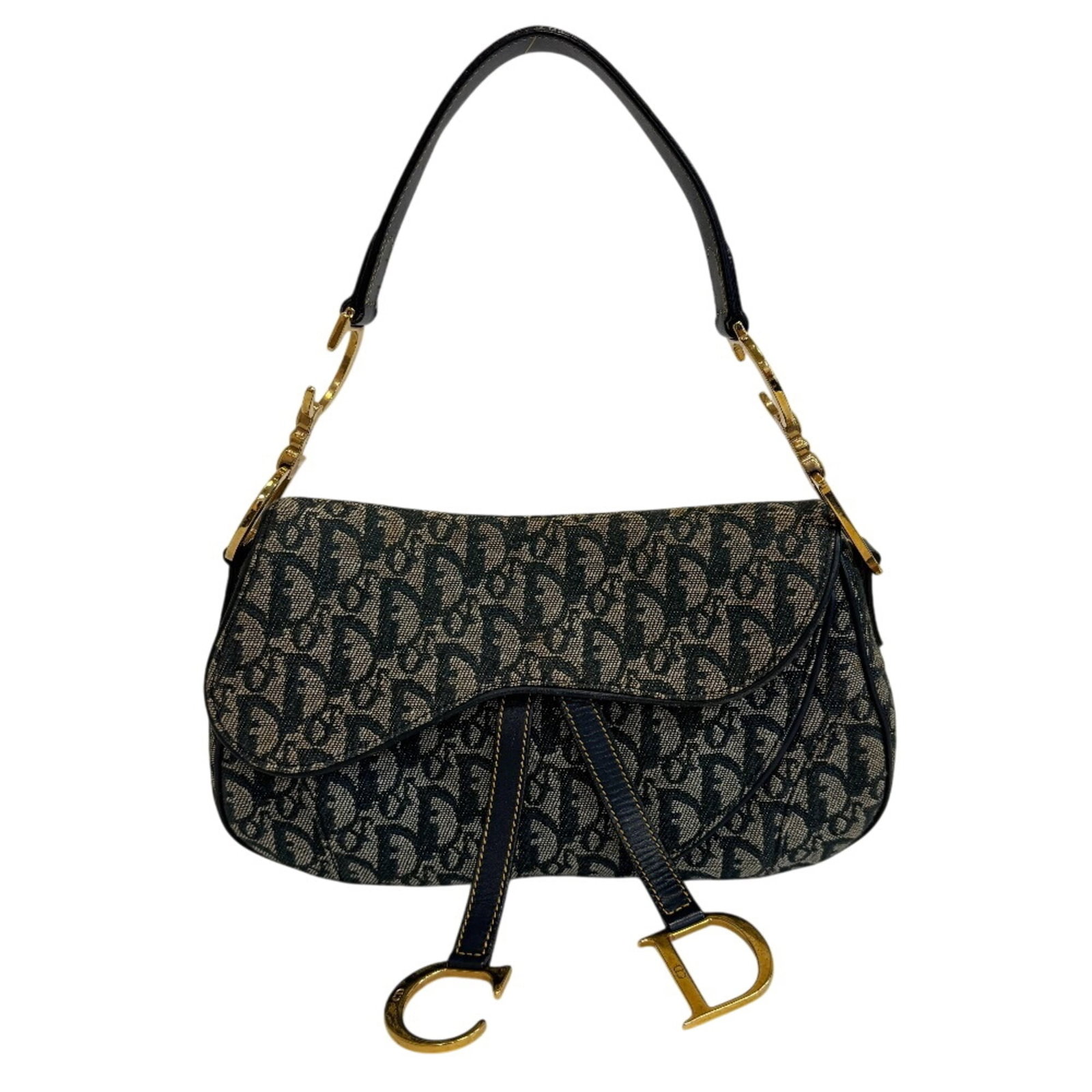 Christian Dior Canvas Shoulder Bag: Christian Dior Canvas Shoulder Bag A timeless piece from the iconic Christian Dior brand, this navy canvas shoulder bag boasts classic design and effortless elegance. With its spacious interior and