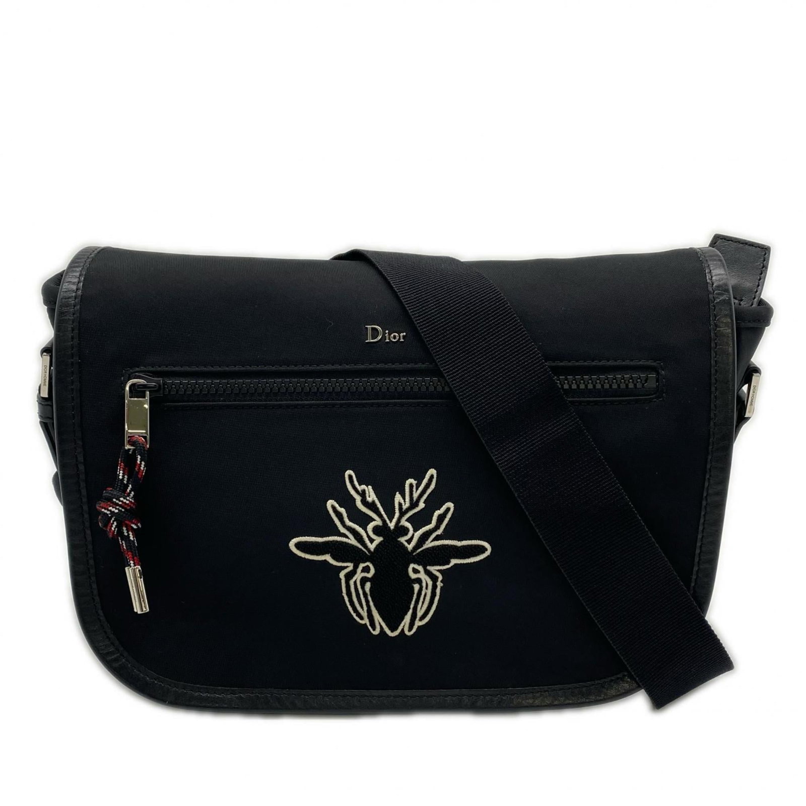 Christian Dior Canvas and Leather Shoulder Bag: Christian Dior Canvas and Leather Shoulder Bag A sleek and sophisticated shoulder bag from Christian Dior, crafted with high-quality canvas and leather in a timeless black and white color