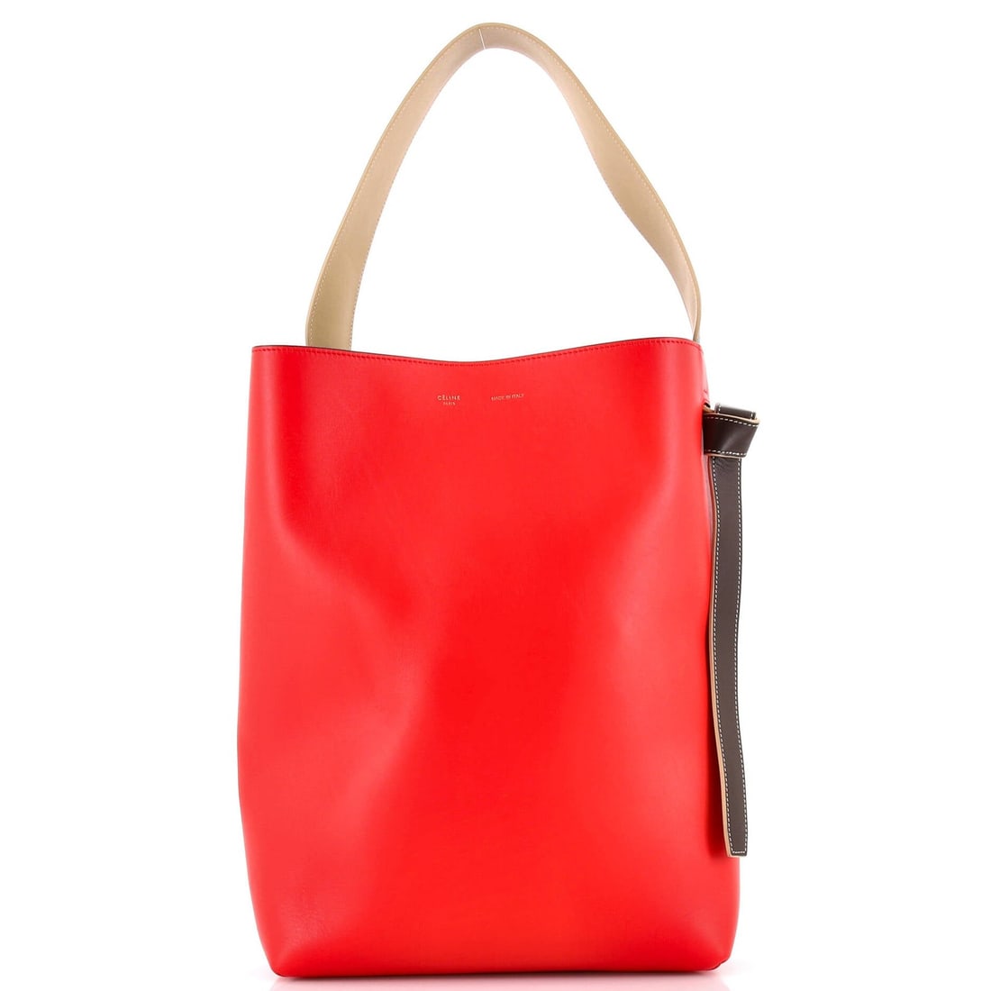 Celine Twisted Cabas Tote in Calfskin - Small: Celine Twisted Cabas Tote in Calfskin - Small The Celine Twisted Cabas Tote in Calfskin is a stylish and versatile small tote that exudes effortless chic. With its twisted design, rich red exterior,