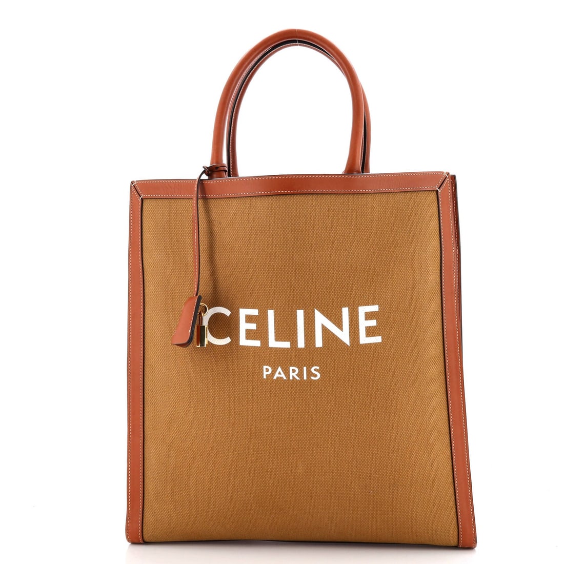 Large Celine Vertical Cabas Tote Canvas with Leather: Large Celine Vertical Cabas Tote Canvas with Leather Experience the timeless elegance of Celine's Vertical Cabas Tote, boasting a sturdy canvas exterior and luxurious leather accents in rich brown