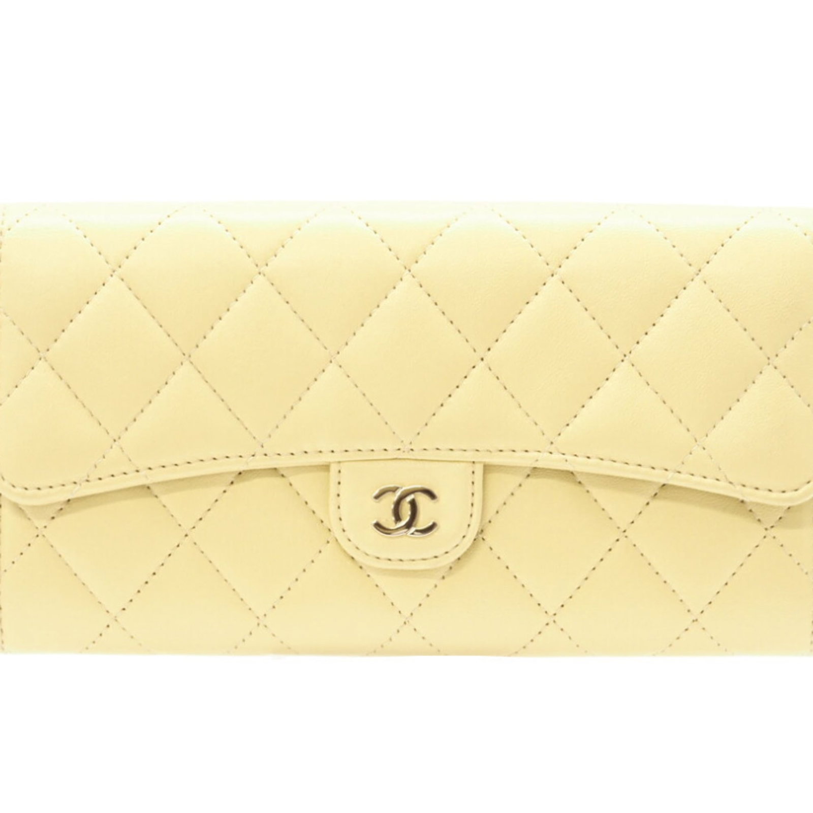 Chanel Bi-Fold Leather Wallet: Chanel Bi-Fold Leather Wallet A timeless Chanel classic, this bi-fold leather wallet boasts sleek lambskin construction and a vibrant yellow hue that adds a pop of personality to any outfit. With its
