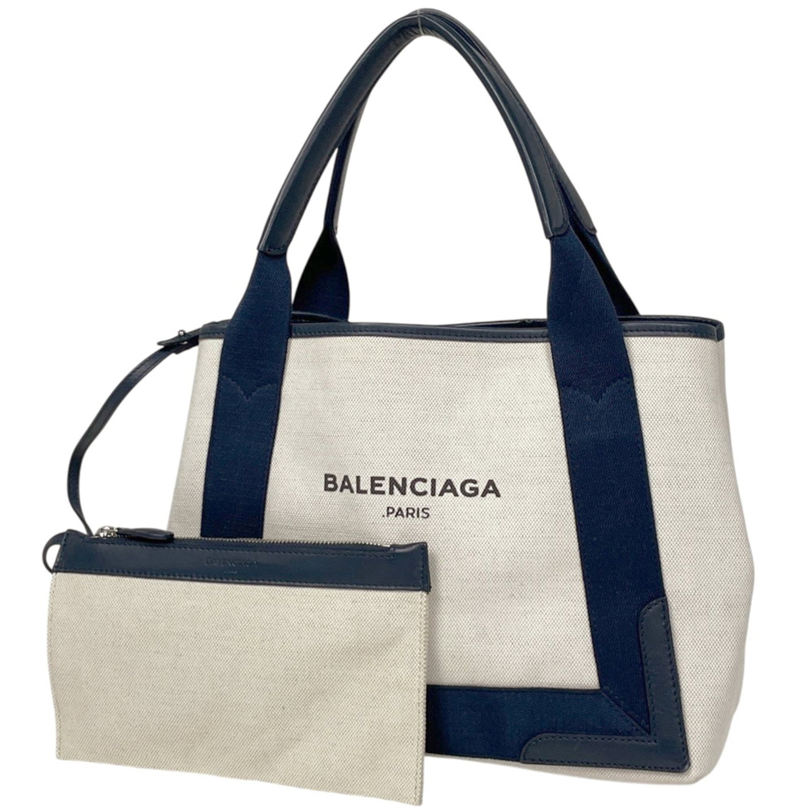 Canvas and Leather Balenciaga Tote Pouch Bag: Canvas and Leather Balenciaga Tote Pouch Bag A pre-loved Balenciaga tote pouch bag in navy, boasting canvas and leather construction for a chic, edgy look. With its classic design and timeless style,