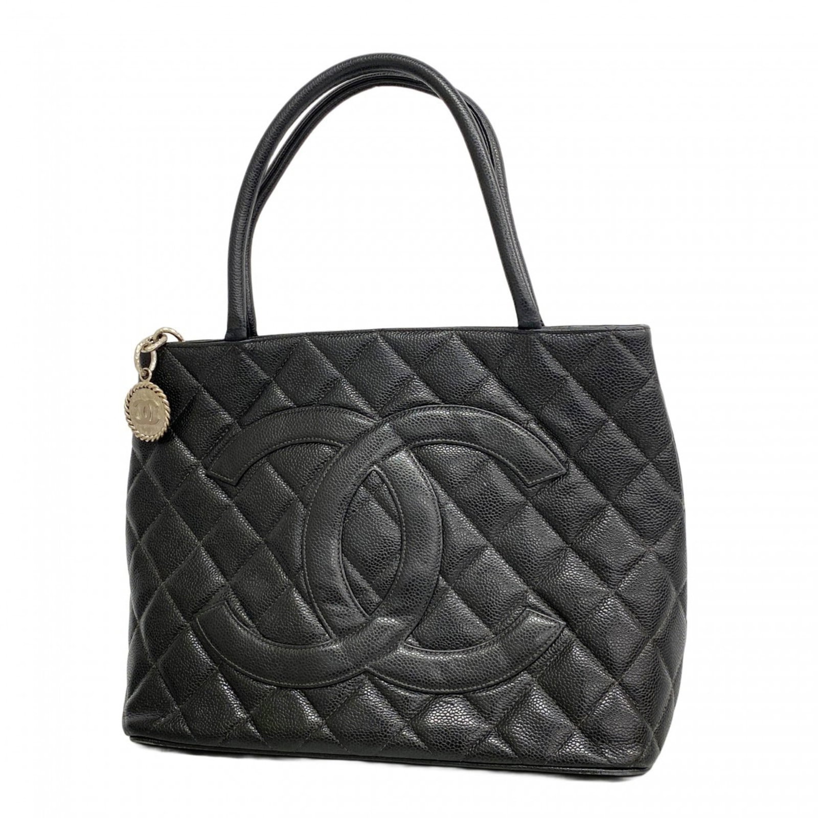 Chanel Calfskin Tote Bag: Chanel Calfskin Tote Bag A timeless and sophisticated choice for any woman, this pre-owned Chanel calfskin tote bag boasts the iconic interlocking CC clasp and sleek silver hardware, adding an air of