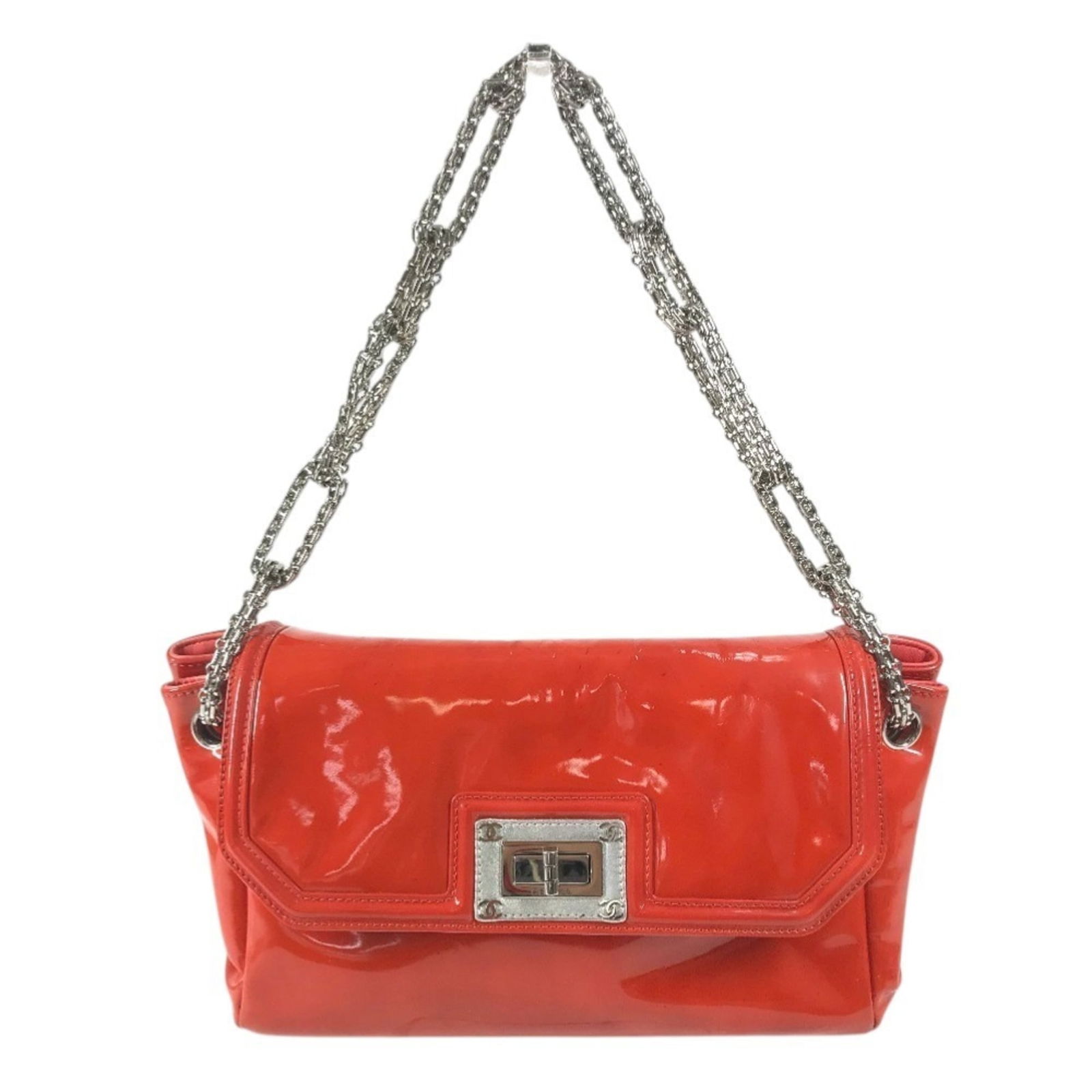 Chanel Patent Leather Shoulder Bag: Chanel Patent Leather Shoulder Bag A vibrant orange or red Chanel patent leather shoulder bag, adding a pop of color to any outfit. With its sleek silver hardware and timeless design, this iconic bag