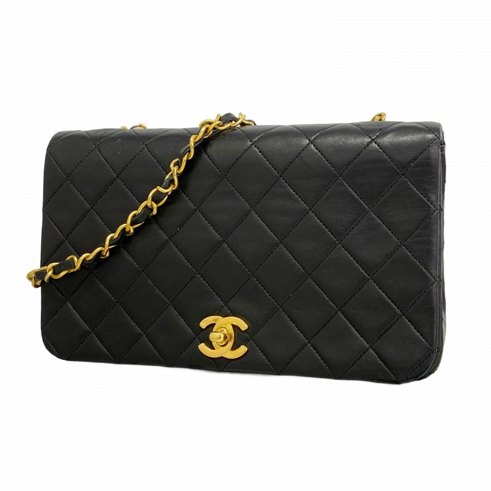 Chanel Shoulder Bag in Leather: Chanel Shoulder Bag in Leather A sleek and sophisticated Chanel shoulder bag in luxurious lambskin leather, this timeless piece boasts elegant silver hardware and a classic design that exudes refineme