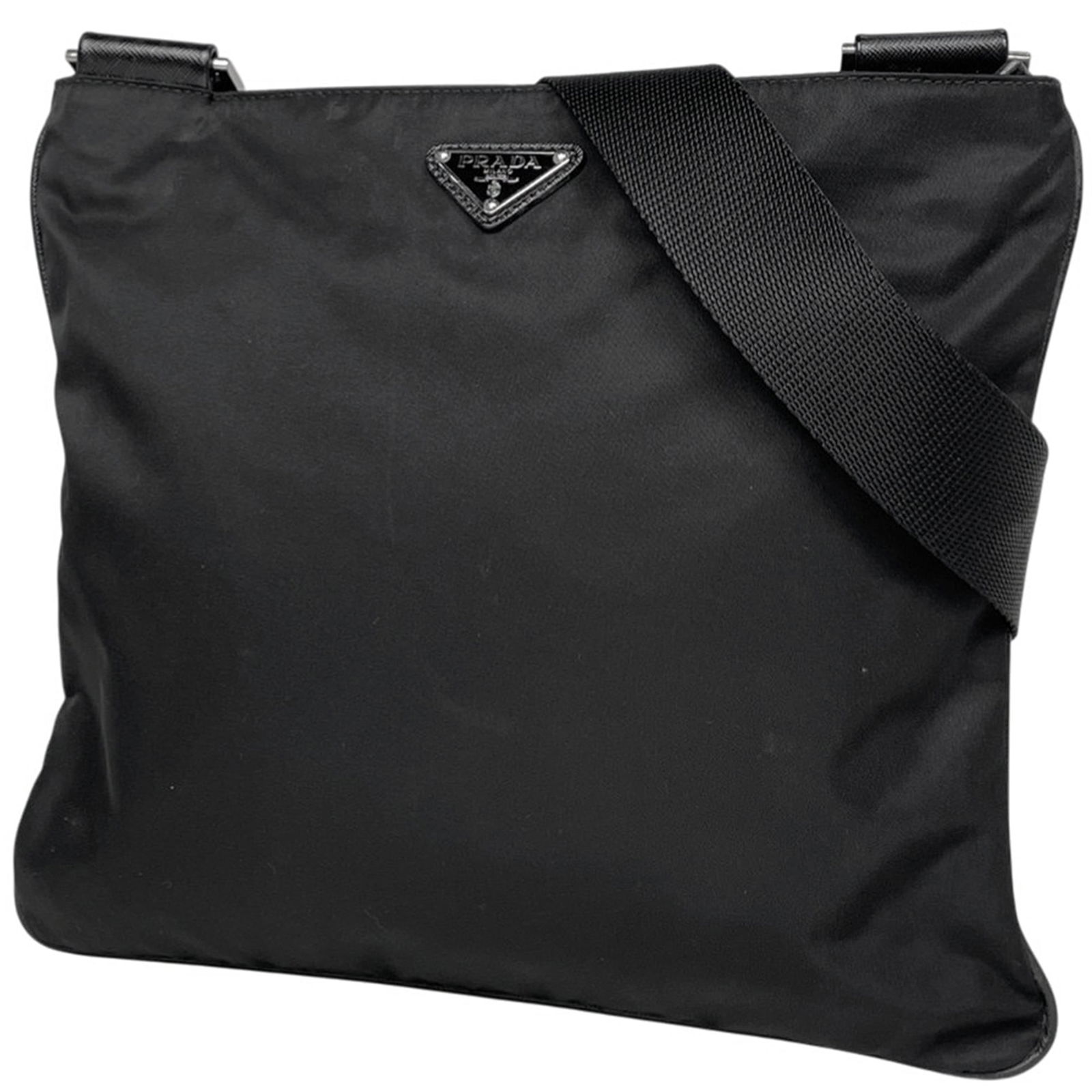 Prada Nylon and Leather Shoulder Bag: Prada Nylon and Leather Shoulder Bag A timeless and versatile Prada shoulder bag, crafted from durable nylon and supple leather, boasts a sleek black finish that exudes sophistication. With its classi