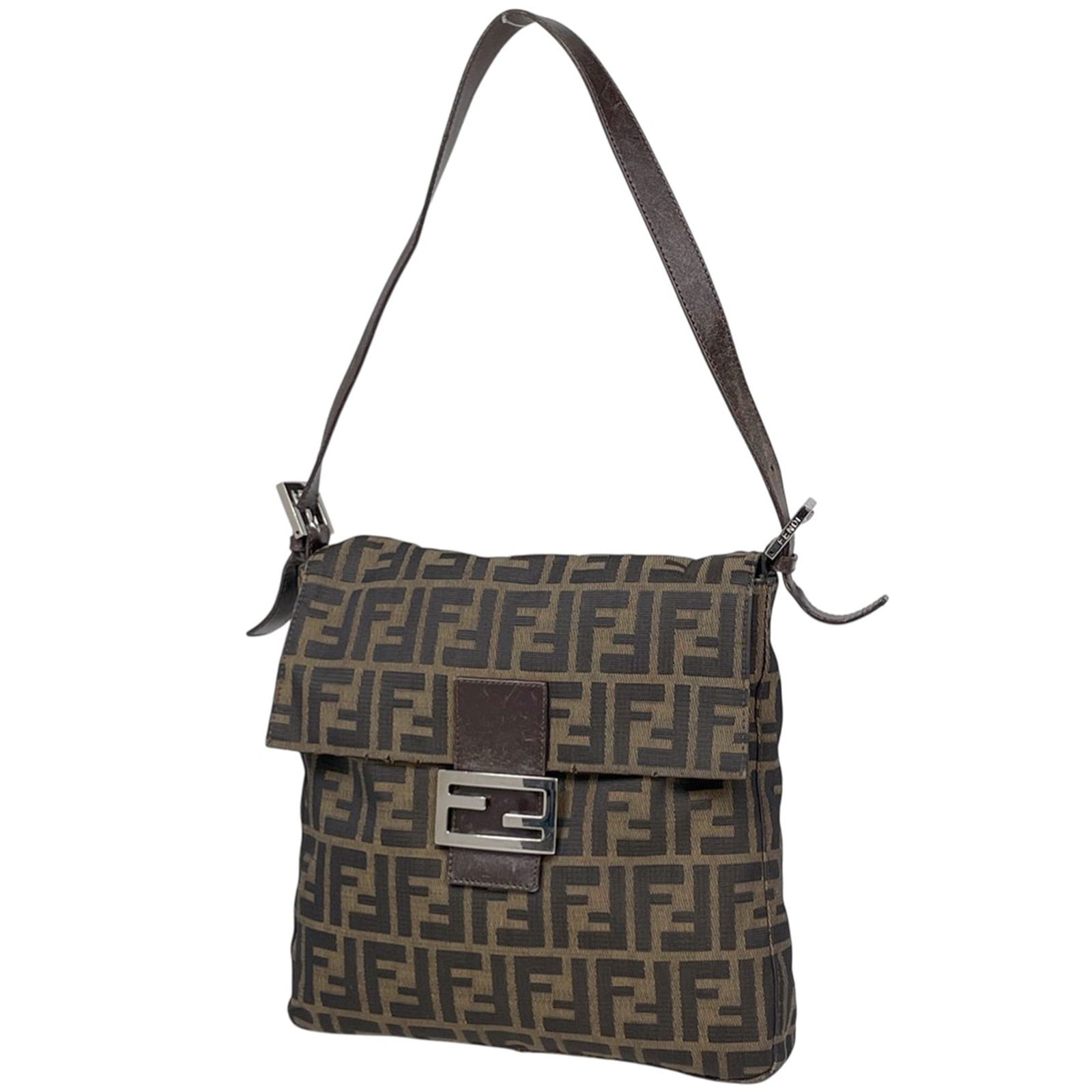 Fendi Shoulder Bag in Leather and Canvas: Fendi Shoulder Bag in Leather and Canvas A timeless Fendi shoulder bag, crafted from rich leather and canvas, adds an effortless touch of sophistication to any outfit. With its classic design and
