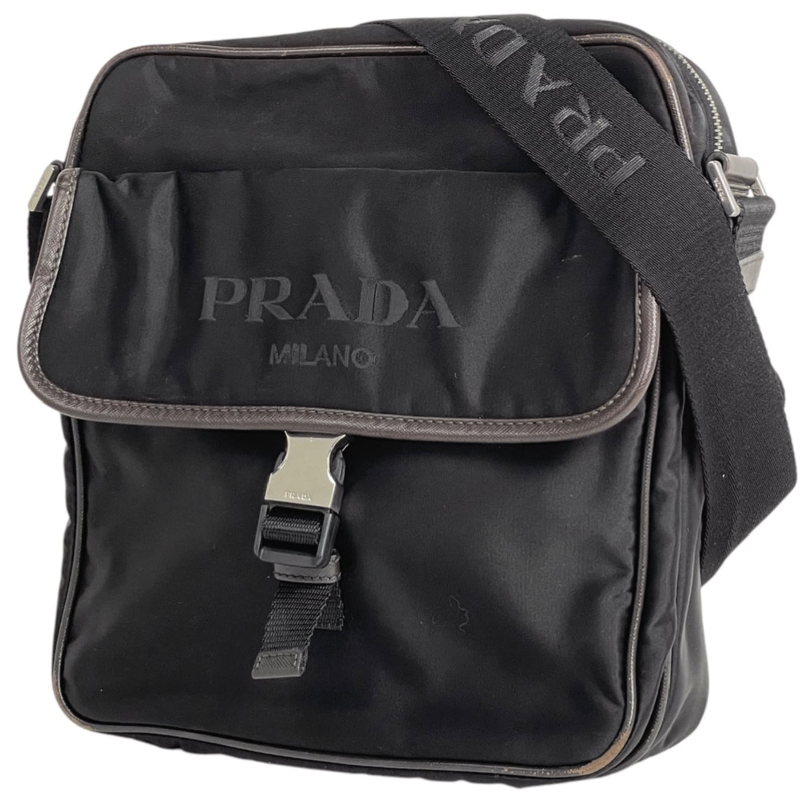 Prada Saffiano Nylon Triangle Leather Shoulder Bag: Prada Saffiano Nylon Triangle Leather Shoulder Bag A sleek and sophisticated shoulder bag, the Prada Saffiano Nylon Triangle Leather is a timeless piece that exudes elegance. Its unique saffiano