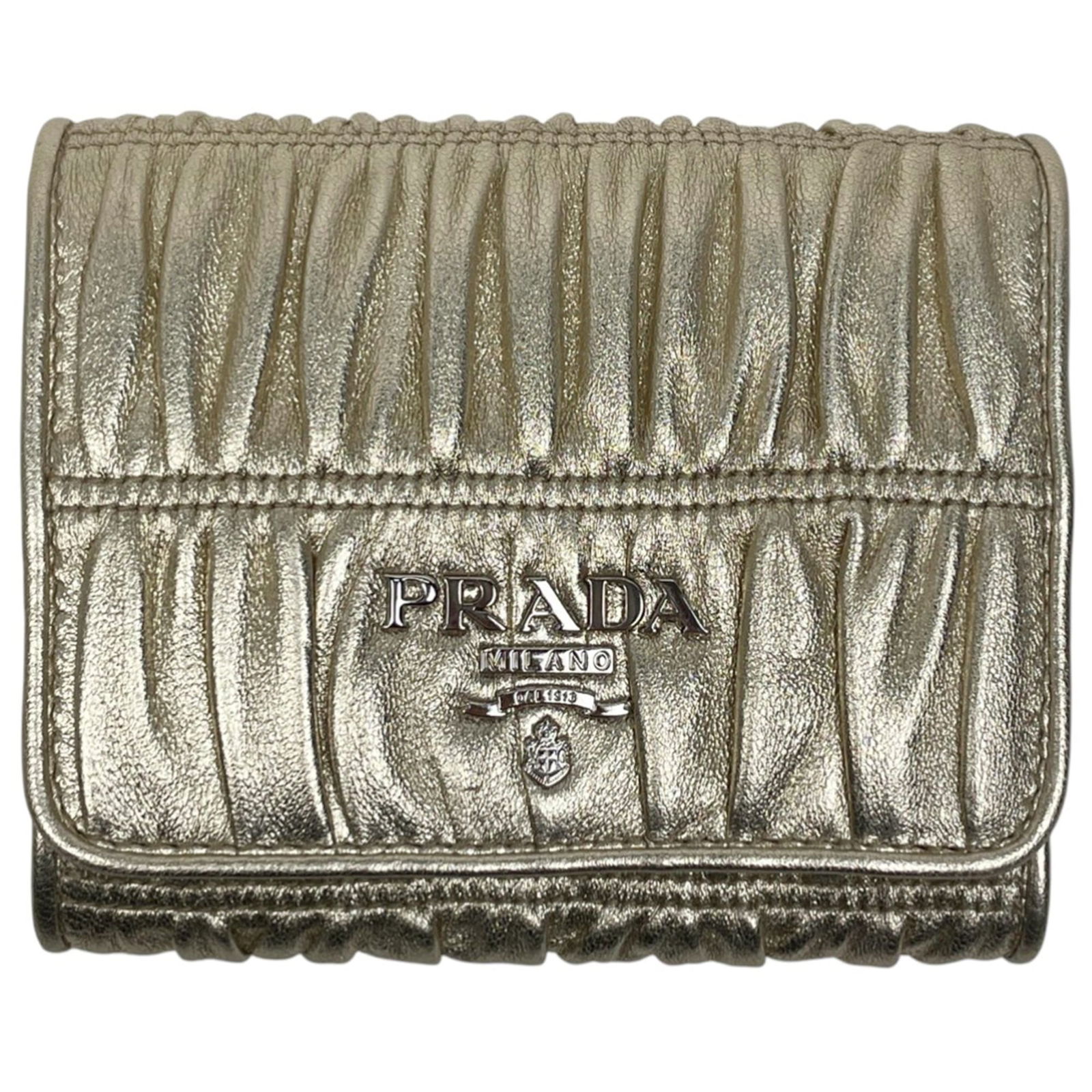 Prada Tri-Fold Leather Wallet: Prada Tri-Fold Leather Wallet A luxurious gold leather tri-fold wallet from Prada, boasting sleek design and premium quality. With its classic tri-fold layout, this wallet is perfect for everyday