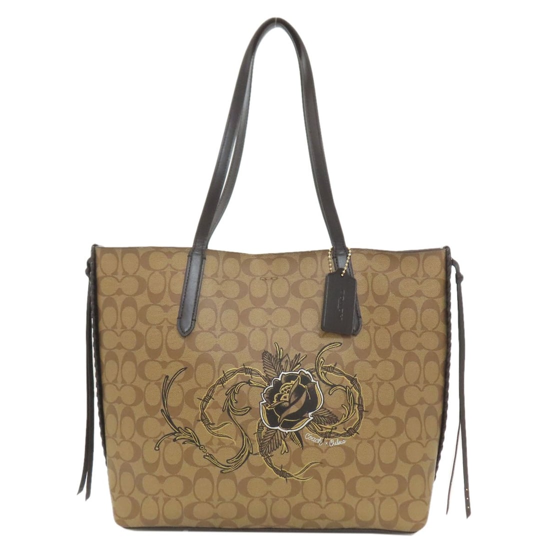 PVC COACH F76778 Flower motif signature Tote Bag: PVC COACH F76778 Flower motif signature Tote Bag Elevate your daily routine with the stylish COACH F76778 Flower motif signature Tote Bag, crafted from durable PVC for long-lasting wear. Its classic b