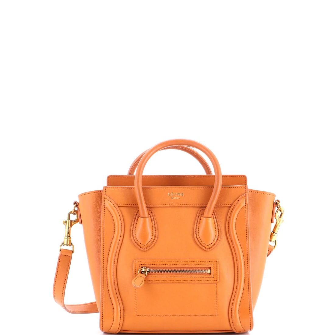 Celine Nano Smooth Leather Luggage Bag: Celine Nano Smooth Leather Luggage Bag Experience the understated elegance of Celine's Nano Smooth Leather Luggage Bag, boasting sleek brown leather exterior and interior, adorned with aged gold