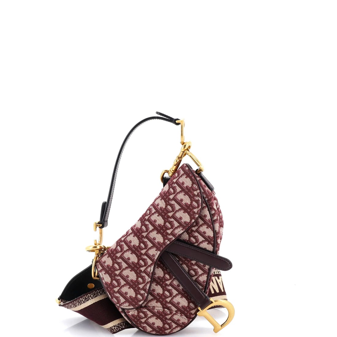 Mini Christian Dior Saddle Handbag Oblique Canvas: Mini Christian Dior Saddle Handbag Oblique Canvas This stunning Mini Christian Dior Saddle Handbag Oblique Canvas is a rare find for any fashion enthusiast. With its bold red exterior and neutral