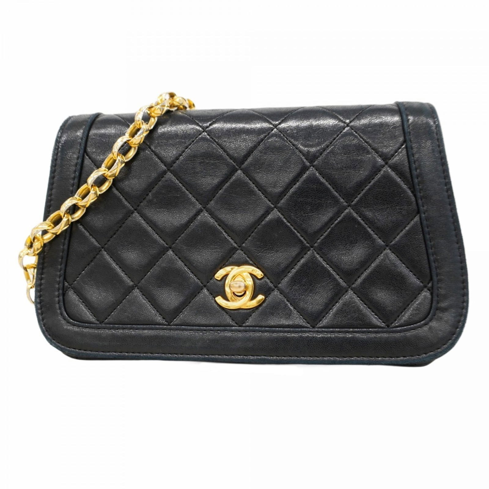 Chanel Shoulder Bag in Leather: Chanel Shoulder Bag in Leather A timeless Chanel shoulder bag in luxurious lambskin leather, adorned with gold hardware, adds an air of sophistication to any outfit. With its classic design and sleek