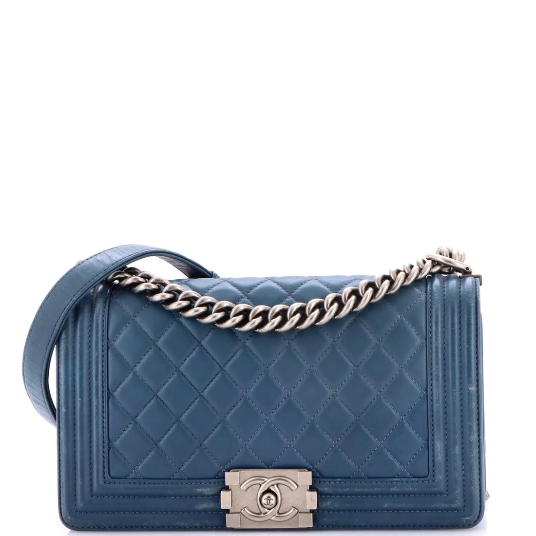 Chanel Boy Flap Bag - Quilted Lambskin in Medium: Chanel Boy Flap Bag - Quilted Lambskin in Medium A quintessential Chanel icon, the Boy Flap Bag exudes timeless elegance with its quilted lambskin exterior and sleek silver hardware. This pre-loved