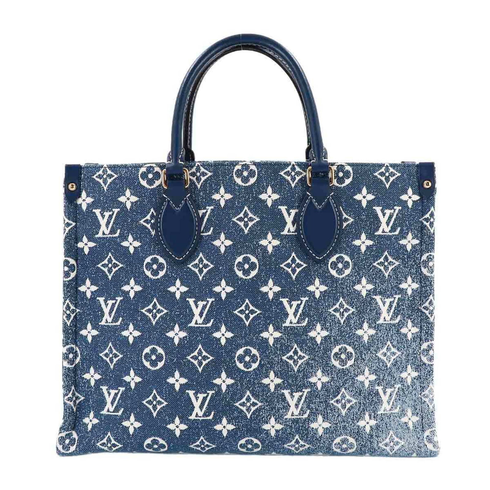 Louis Vuitton Denim Tote Leather Handbag: Louis Vuitton Denim Tote Leather Handbag A stunning Louis Vuitton denim tote bag, boasting the iconic brand's signature monogram pattern on a rugged denim exterior, adds an edgy touch to any outfit.