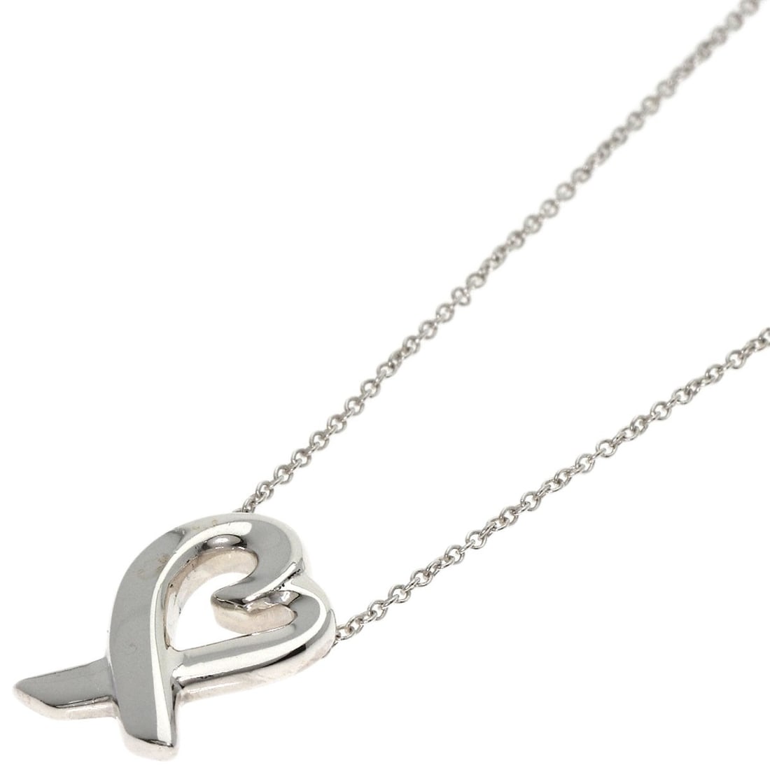 Silver TIFFANY&Co. Loving heart Necklace: Silver TIFFANY&Co. Loving heart Necklace A timeless piece of elegance, this sterling silver Tiffany&Co. necklace boasts a delicate loving heart design that exudes classic sophistication. Made from