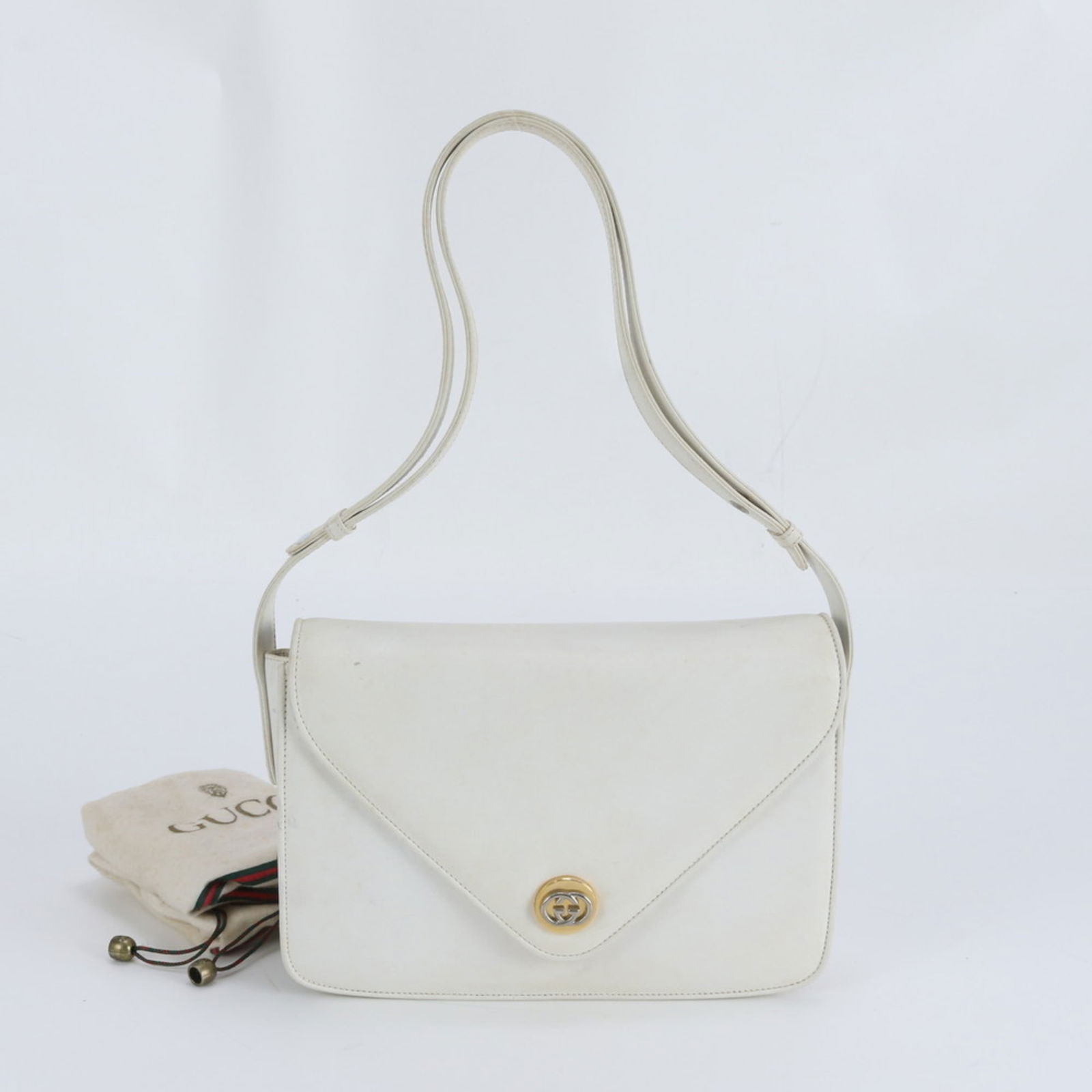 Gucci Leather Shoulder Bag: Gucci Leather Shoulder Bag A timeless Gucci leather shoulder bag in rich brown and crisp white, perfect for adding a touch of sophistication to any outfit. With its classic design and premium
