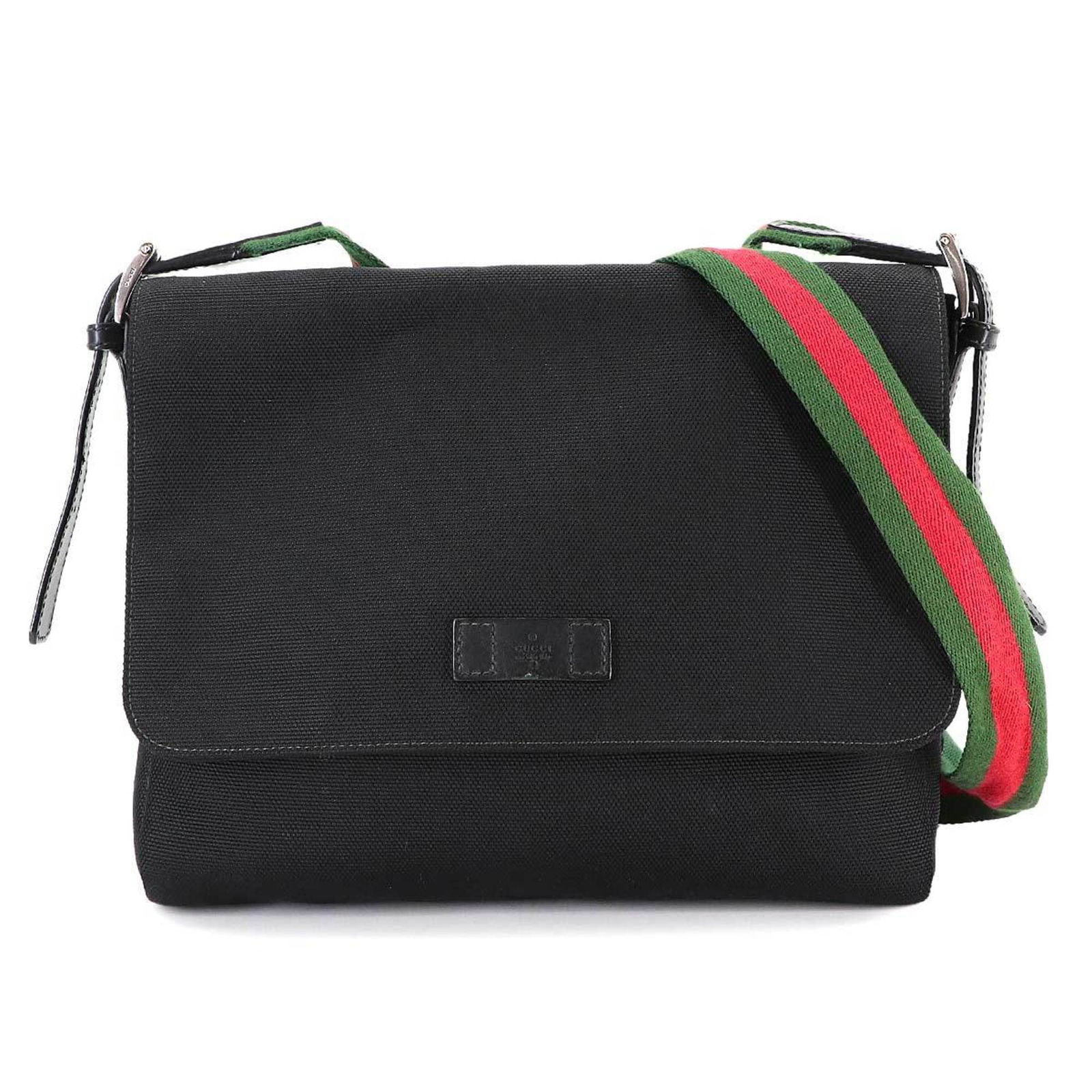 Leather - Gucci Handbag - Messenger Bag Canvas: Leather - Gucci Handbag - Messenger Bag Canvas A stunning Gucci messenger bag, crafted from high-quality canvas and leather, boasts a sleek black design that exudes timeless sophistication. With its
