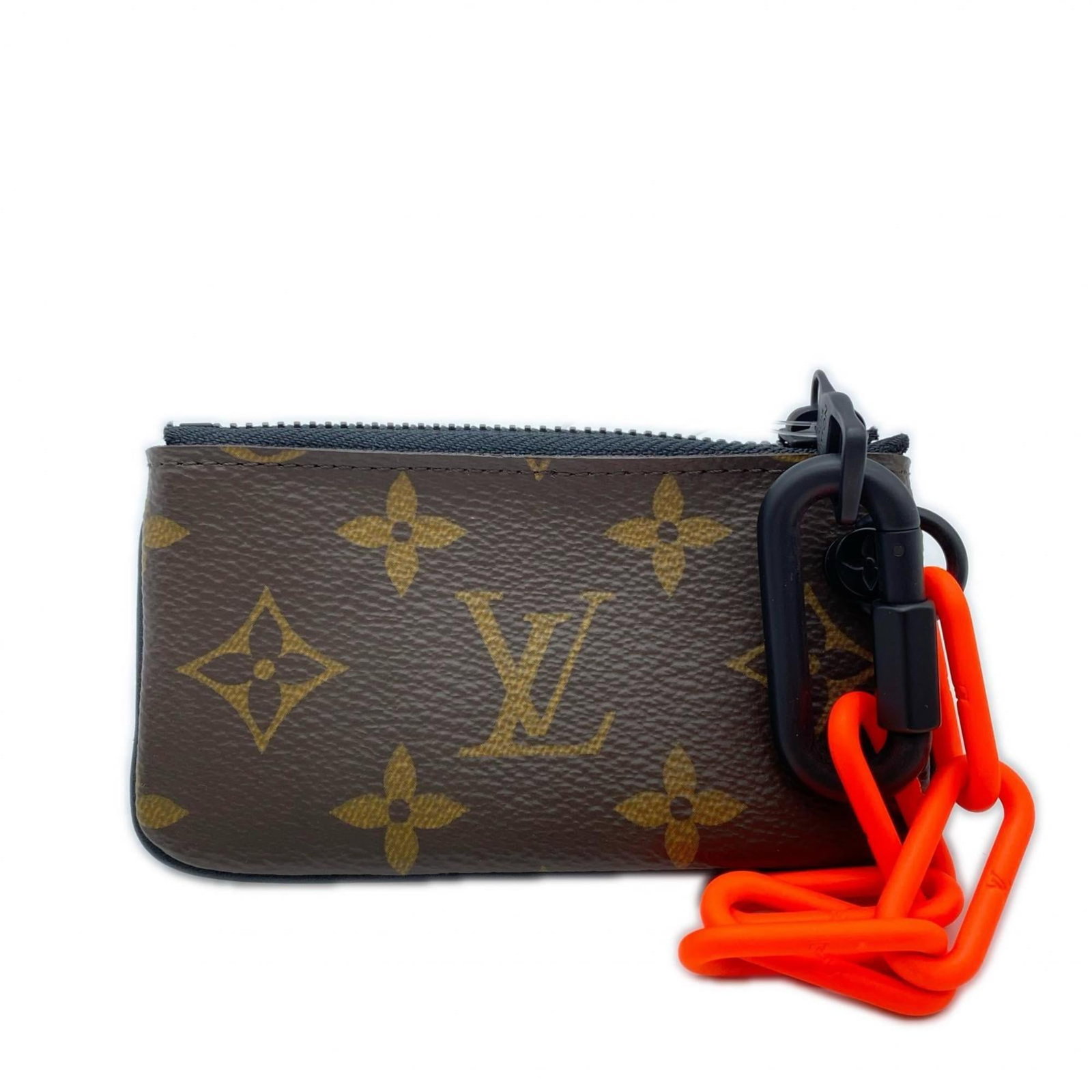 Louis Vuitton Coin Purse - Coated Canvas: Louis Vuitton Coin Purse - Coated Canvas A chic and practical accessory for the modern woman, this Louis Vuitton coin purse is crafted from high-quality coated canvas in rich brown tones. With its