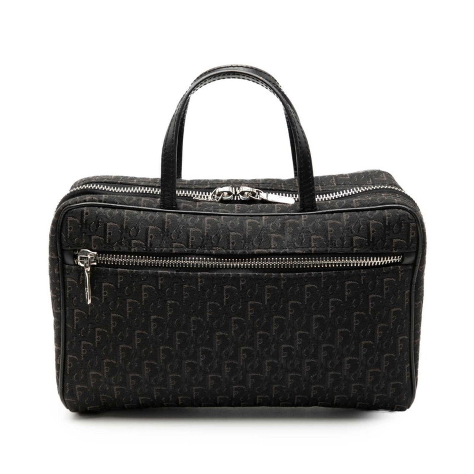 Christian Dior Canvas and Leather Handbag: Christian Dior Canvas and Leather Handbag A timeless piece from the iconic Christian Dior brand, this canvas and leather handbag boasts sleek black design with subtle scratches and wear that add to