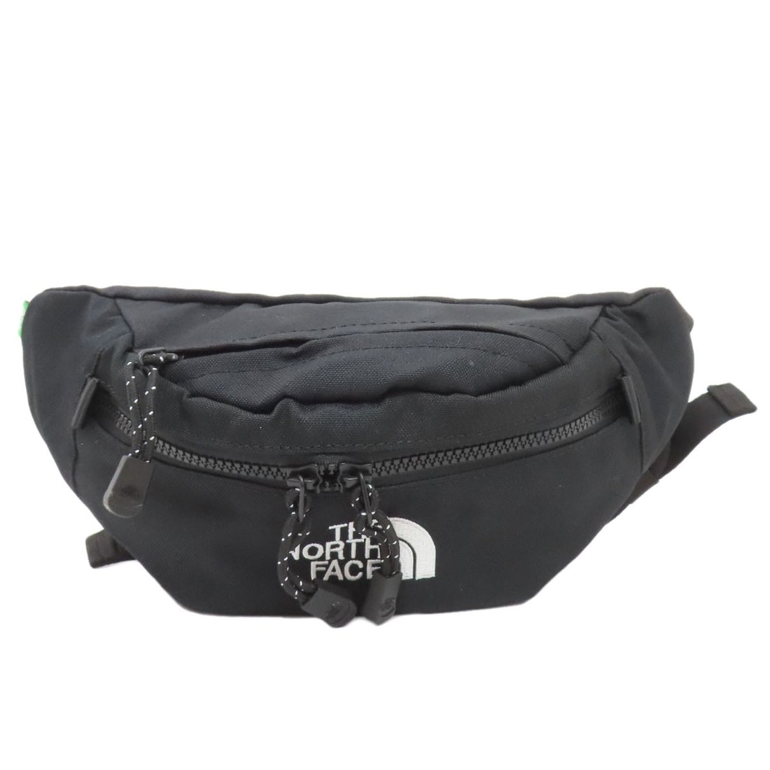 Nylon Canvas The North Face Logo Body Bag: Nylon Canvas The North Face Logo Body Bag Elevate your daily essentials with the iconic The North Face logo body bag, crafted from durable nylon canvas in sleek black. Perfect for carrying the bare